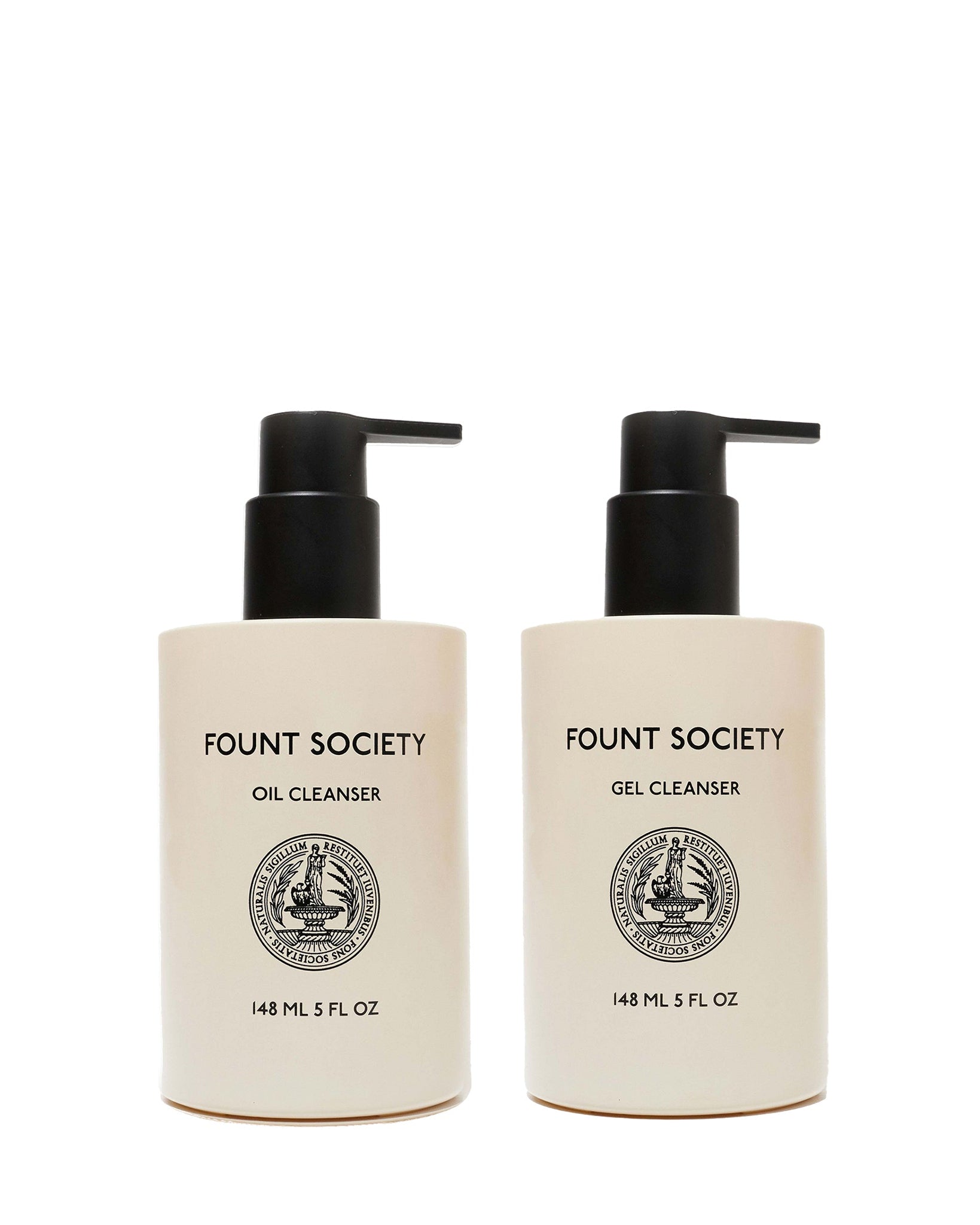 Two beige pump bottles from Cozy Earth’s Double Cleanse Duo—Oil Cleanser on the left, Gel Cleanser on the right—feature black pumps, black text, round front emblems, and each holds 148 mL (5 fl oz).