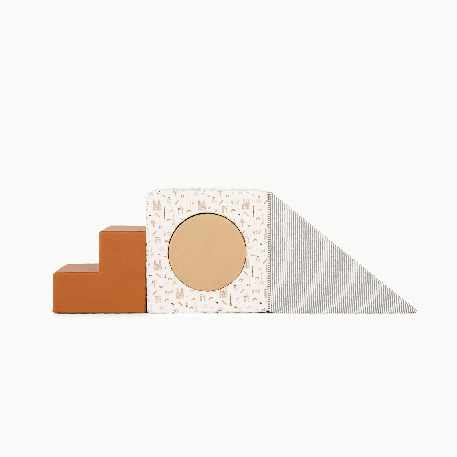 The Gathre Wholesale Block Playset features soft foam shapes for kids in Paris, Wheat, Stone Stripe, and Ginger colors—including steps, a printed cube with a circular cutout, and a striped wedge ramp—all arranged on a white background.