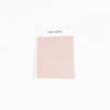 A sample swatch of Bamboo Sheet fabric from Cozy Earth, in light pink, is displayed on a white card against a white background.|Color:Peony