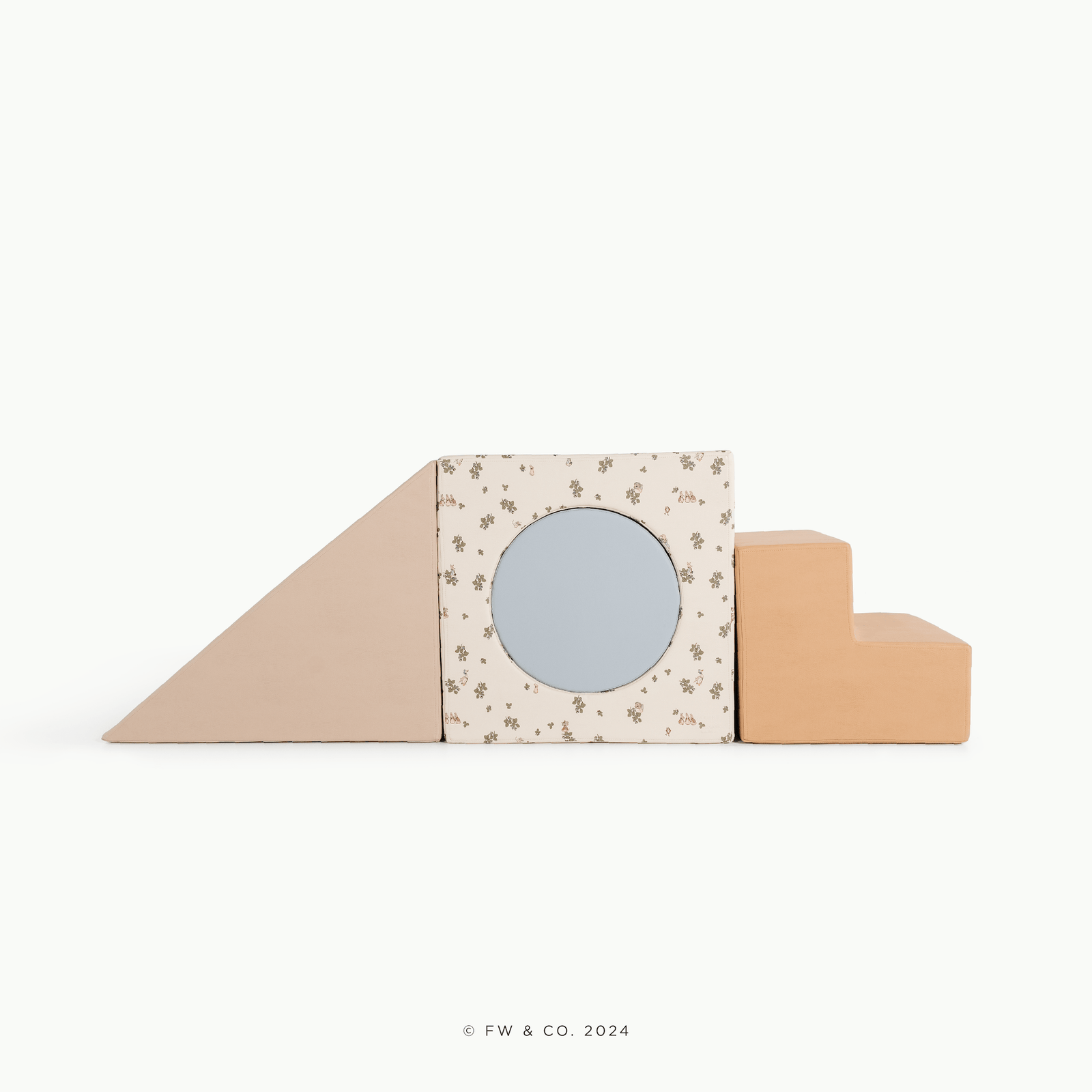 The Gathre Wholesale Block Playset features three foam shapes for children—a beige ramp, a floral-patterned square block with a circular cutout, and tan steps—arranged in a row against a plain white background.