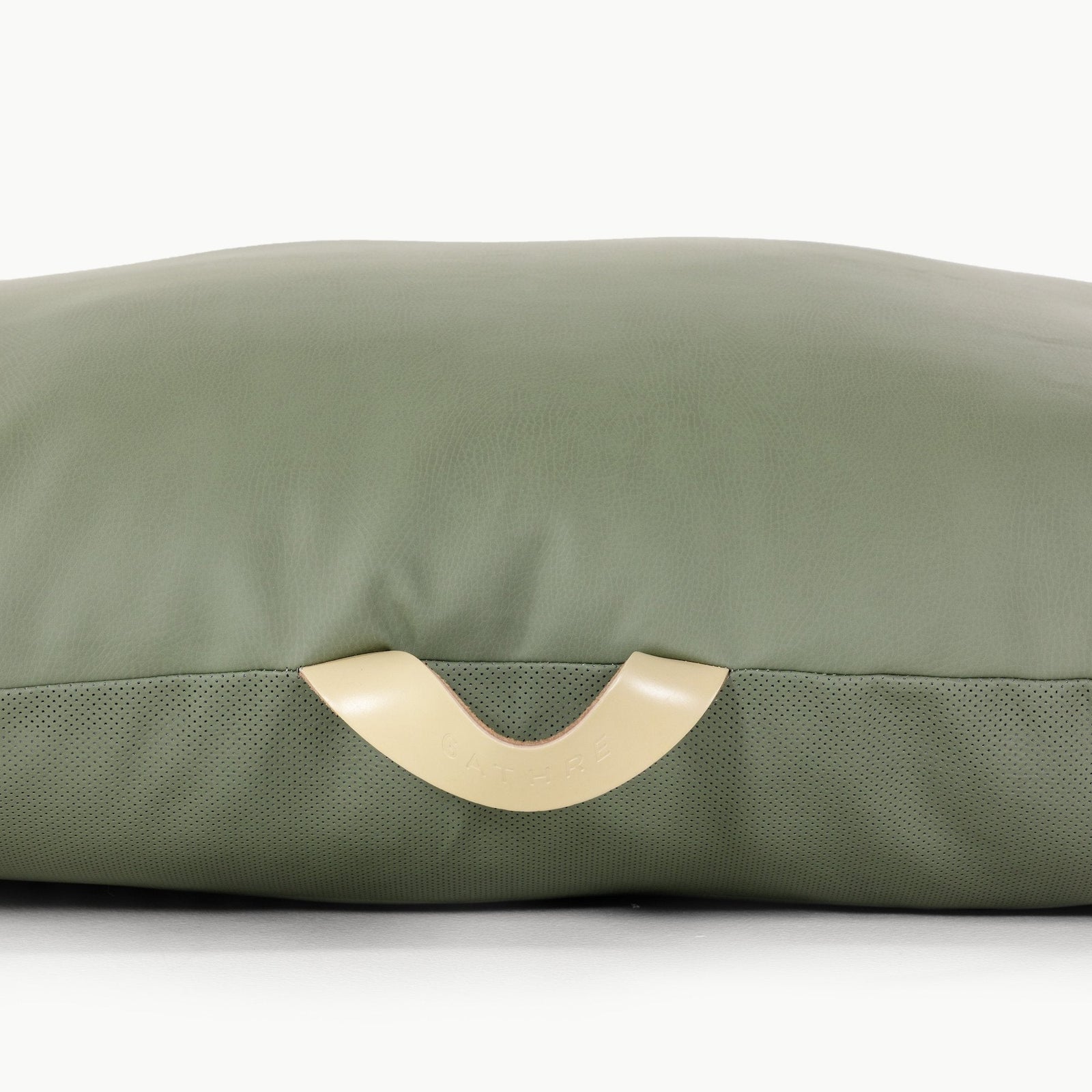 A close-up shows the Gathre Wholesale Floor Cushion: green with a smooth top, textured bottom, and a beige side handle.