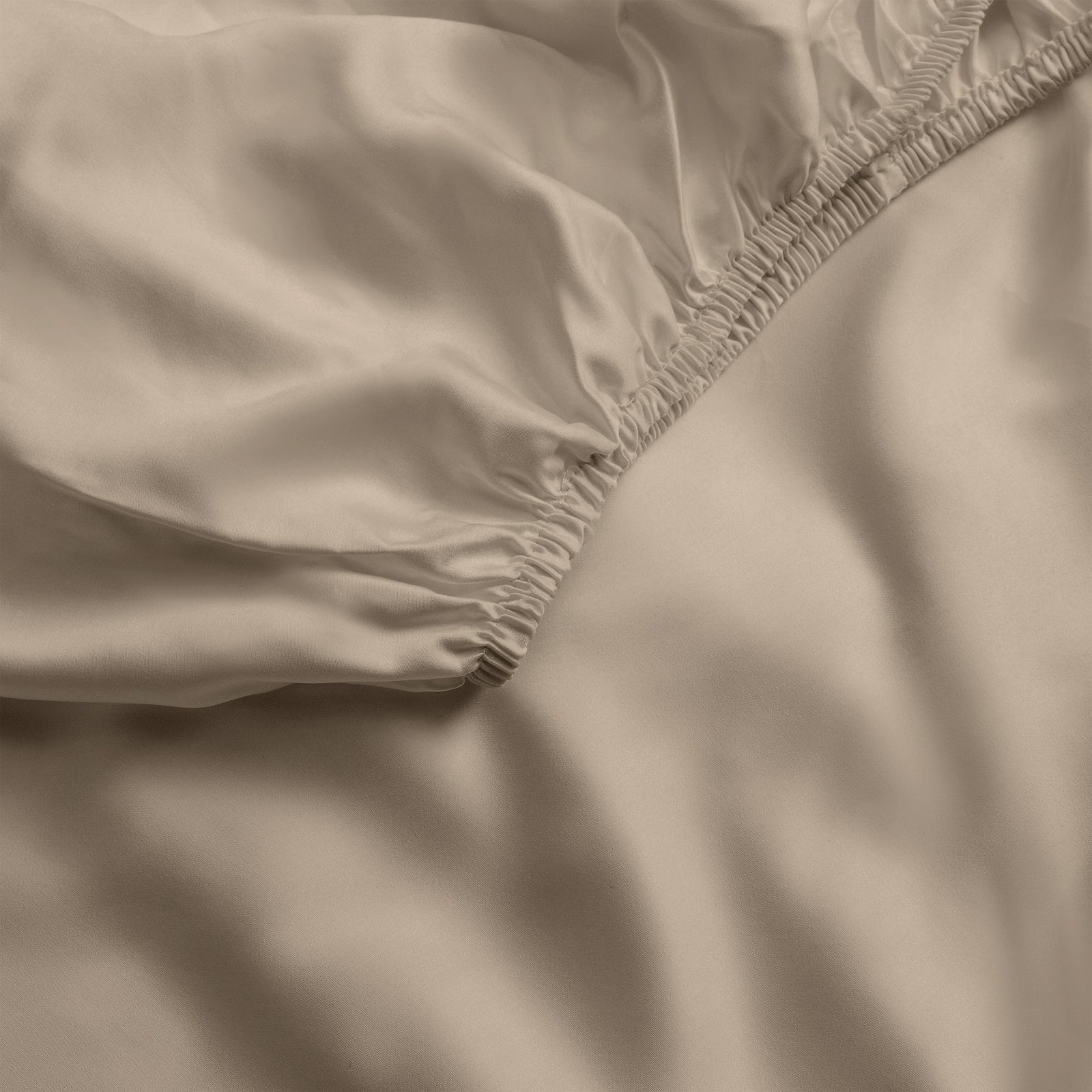 Close up of walnut fitted crib sheet 