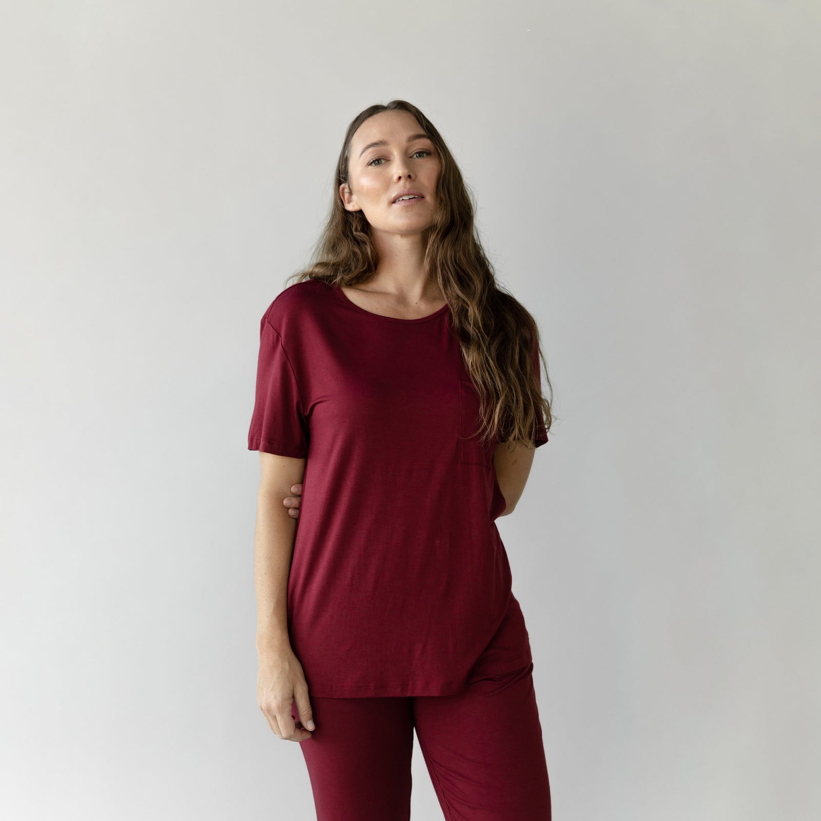 Woman wearing Cozy Earth Bamboo Lounge Tee in dark burgundy