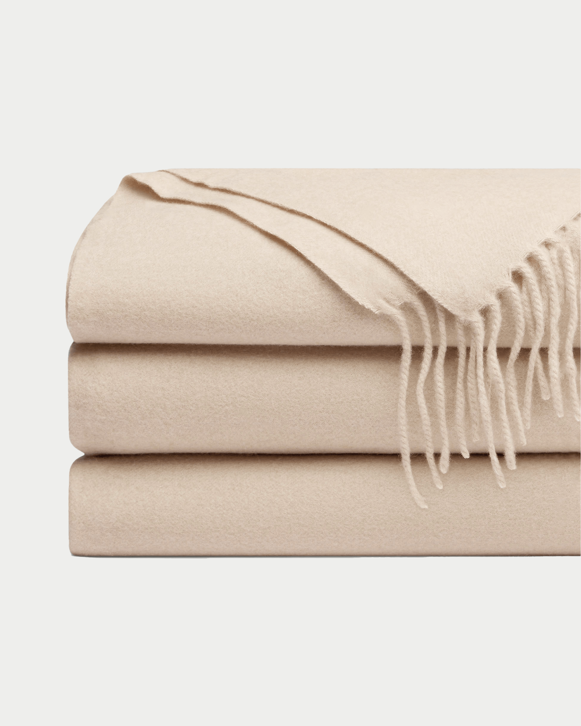 Dune cashmere tassel throw folded with white background |Color:Dune