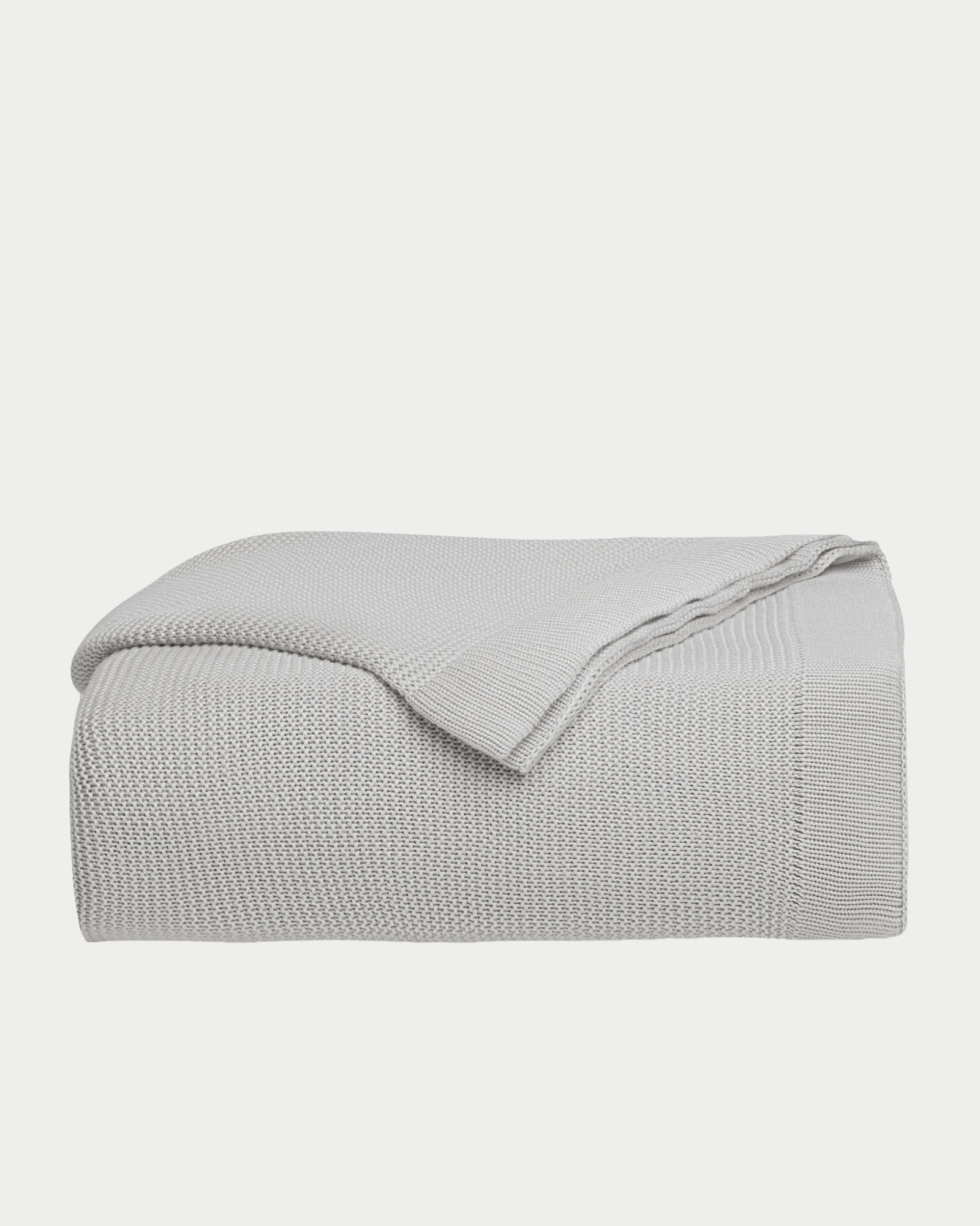 Light Grey cloud knit blanket folded with white background
