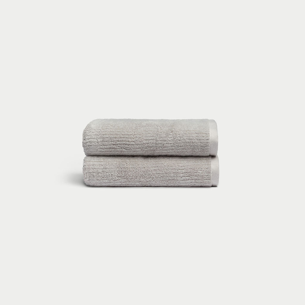 Ribbed Terry Hand Towels in the color Light Grey. Photo of product taken with a white background. 