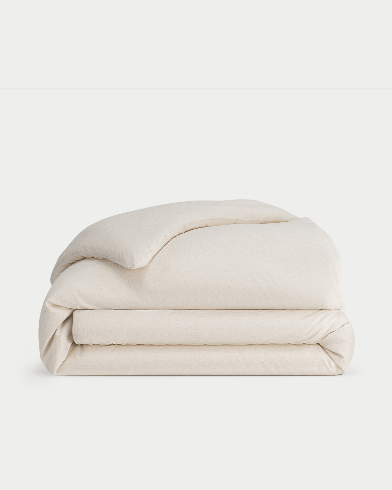 Natural Linen Duvet Cover neatly folded over white background.