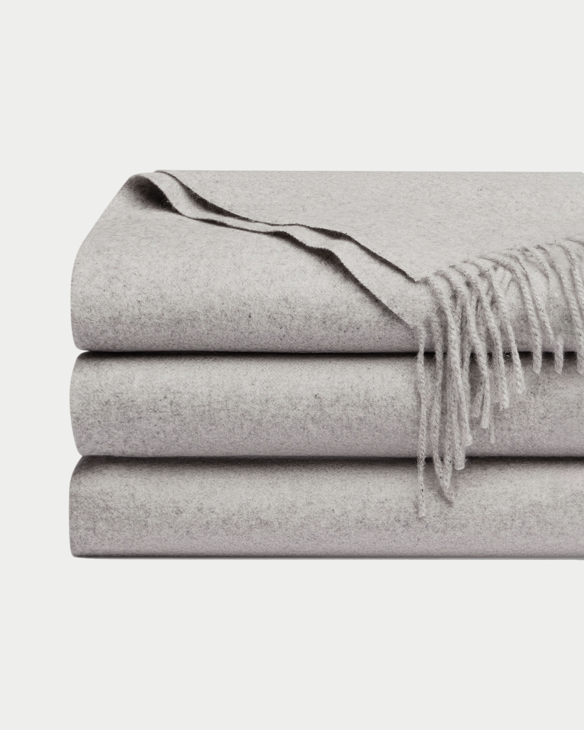 Pebble cashmere tassel throw folded with white background |Color:Pebble