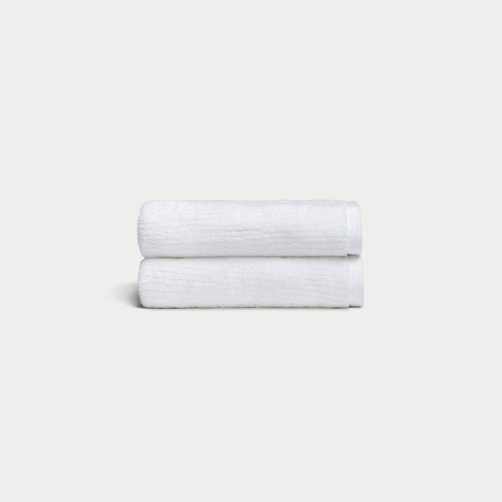 Ribbed Terry Hand Towels in the color White. Photo of product taken with a white background. 