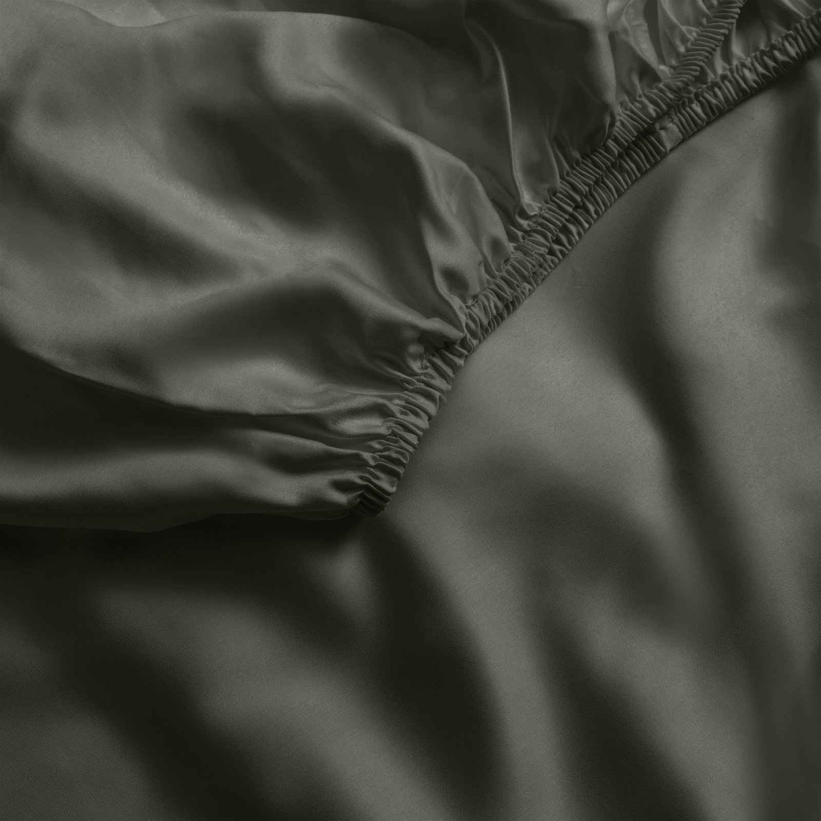 Close up of olive fitted crib sheet 