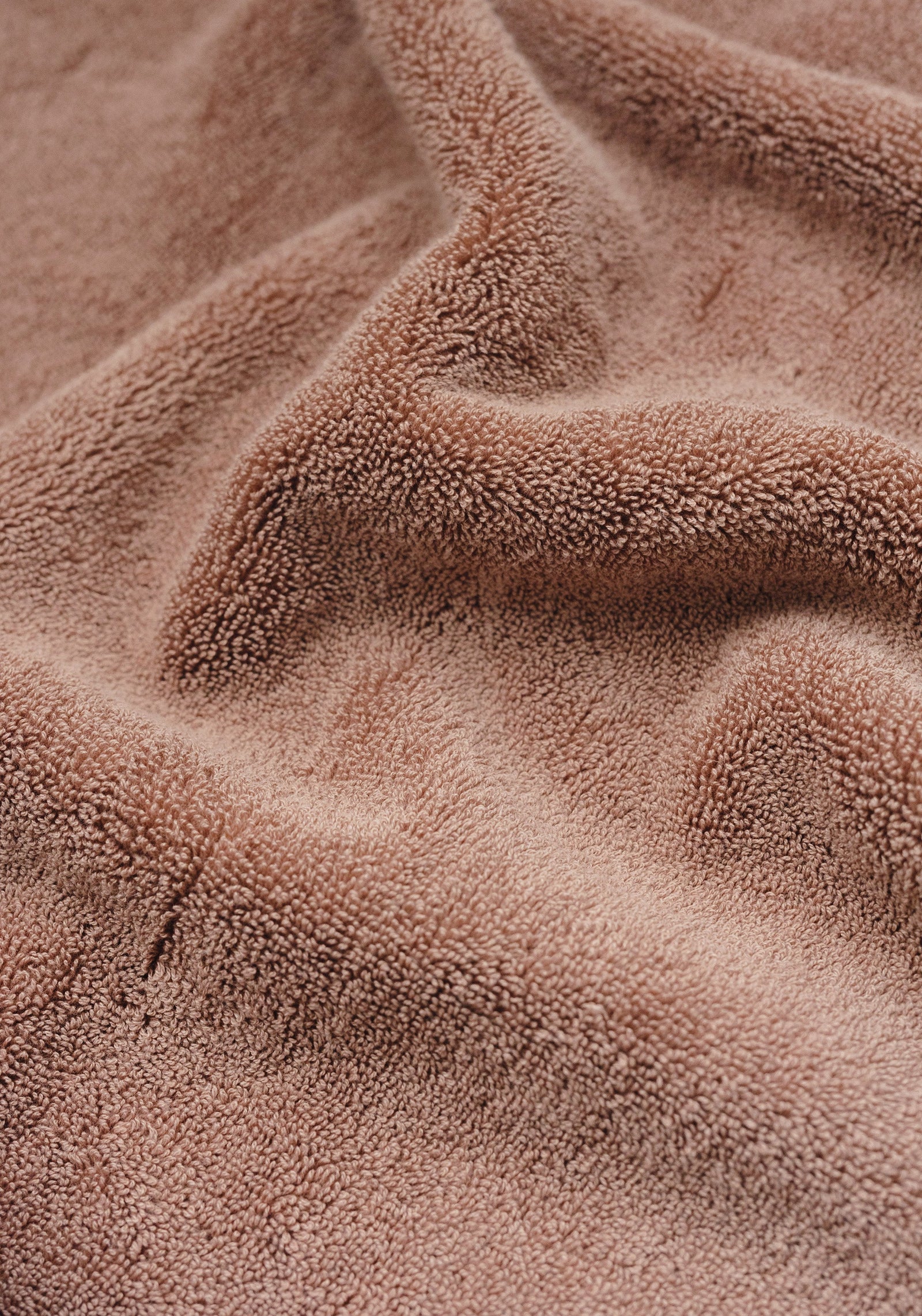 Premium Plush Bath Towel in the color Clay. Photo of Premium Plush Bath Towel taken as a close up only showing the Premium Plush Bath Towel's texture 