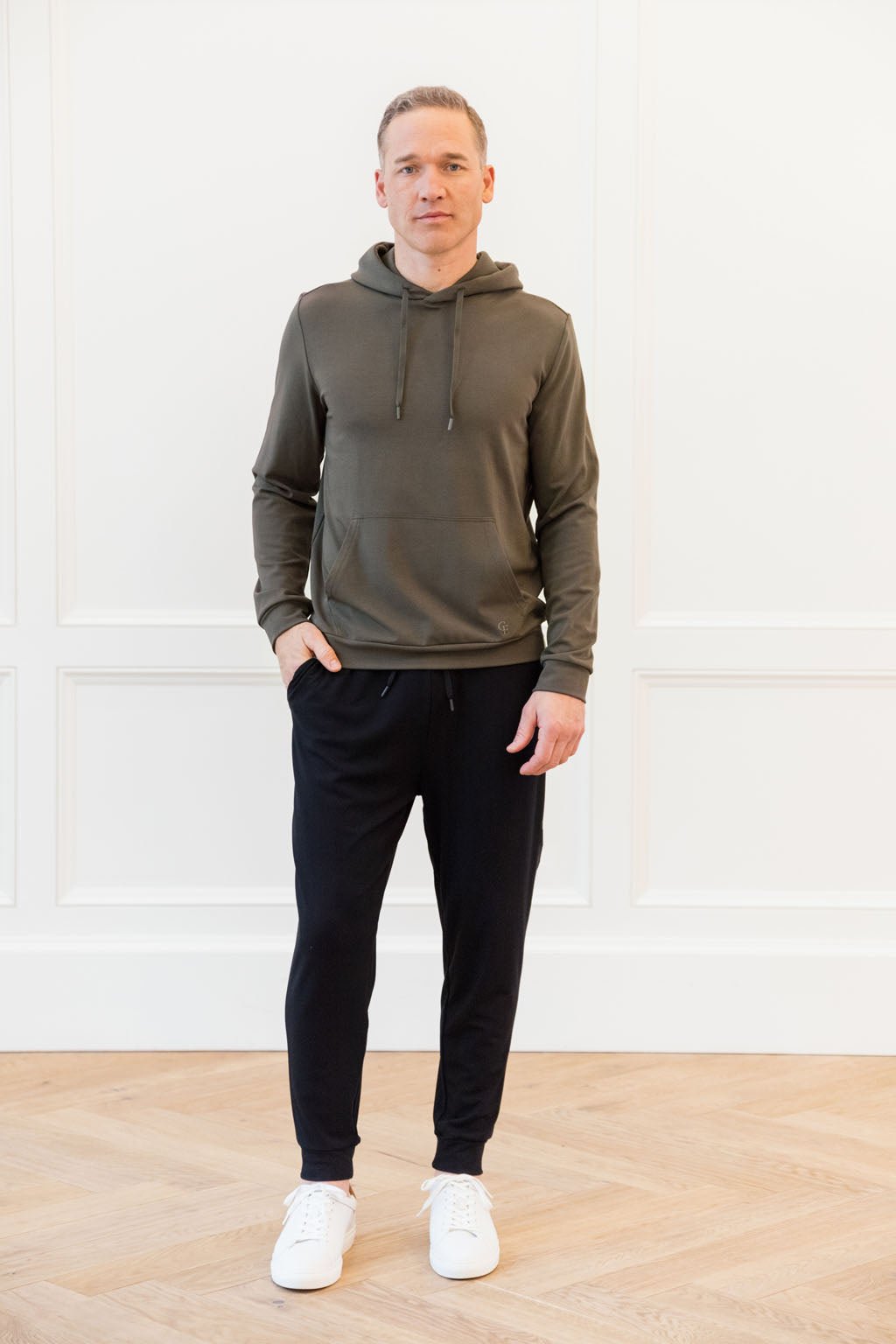 Hunter Bamboo Hoodie worn by man standing in front of white background.