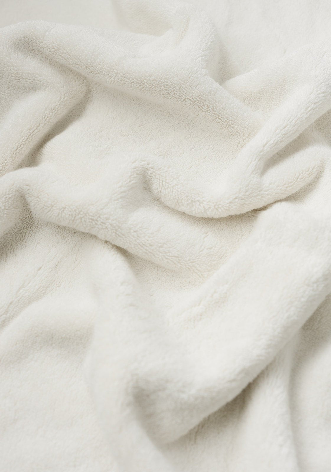 Premium Plush Bath Towel in the color Sea Shell. Photo of Sea Shell Premium Plush Bath Towel taken as a close up only showing the Premium Plush Bath Towel