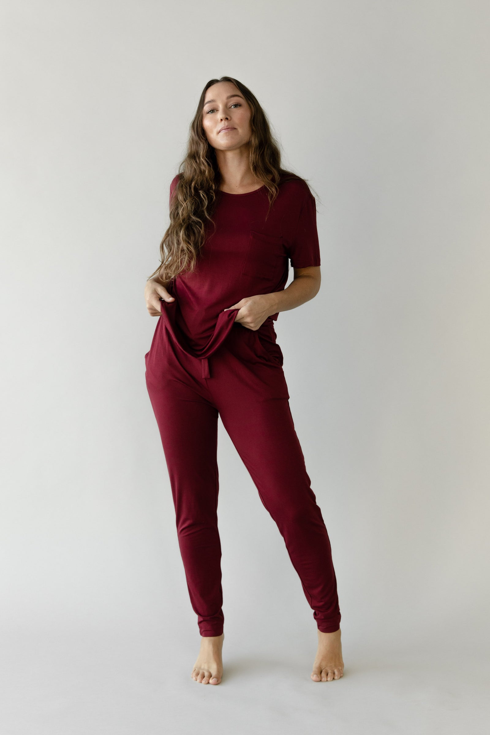 Woman wearing Cozy Earth Bamboo Lounge Tee in dark burgundy