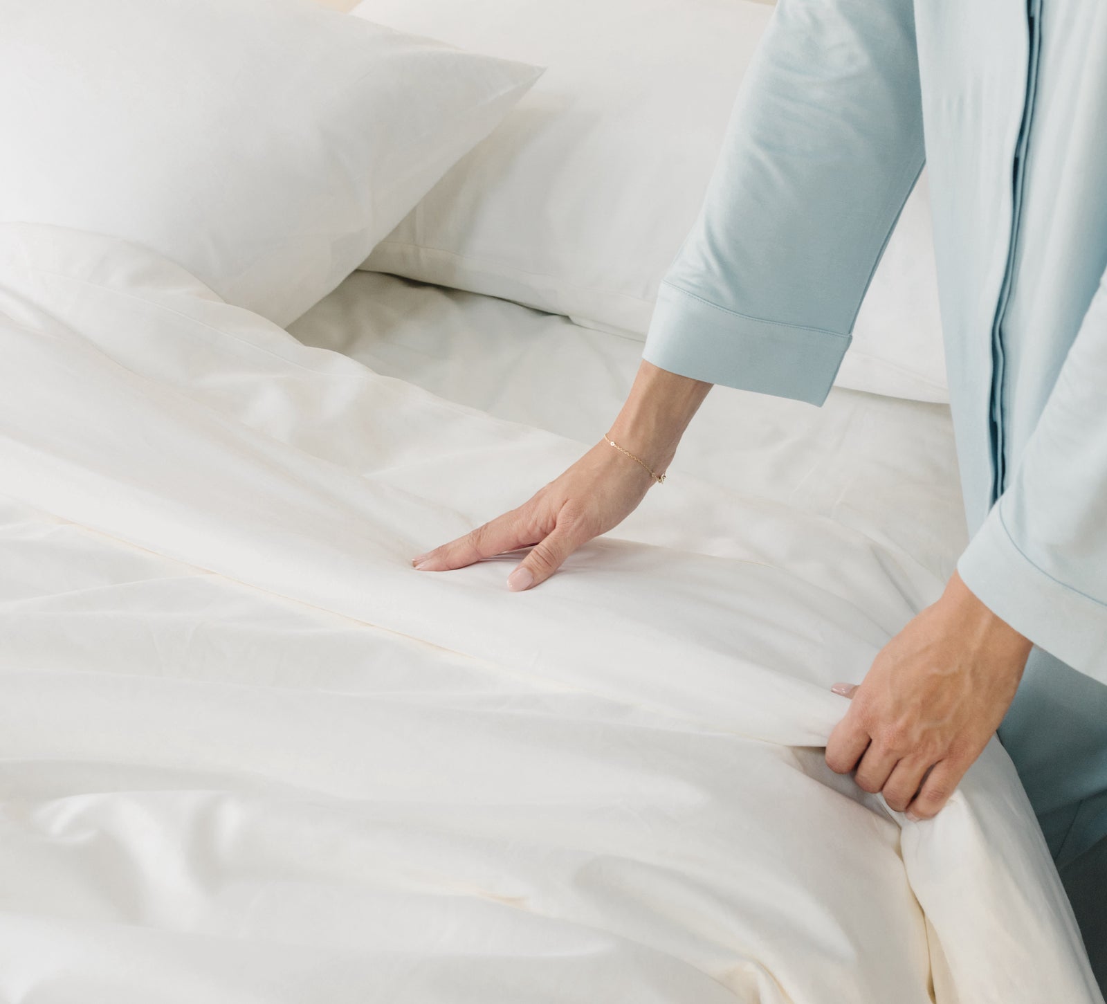 White Duvet Cover and comforter resting on a bed.