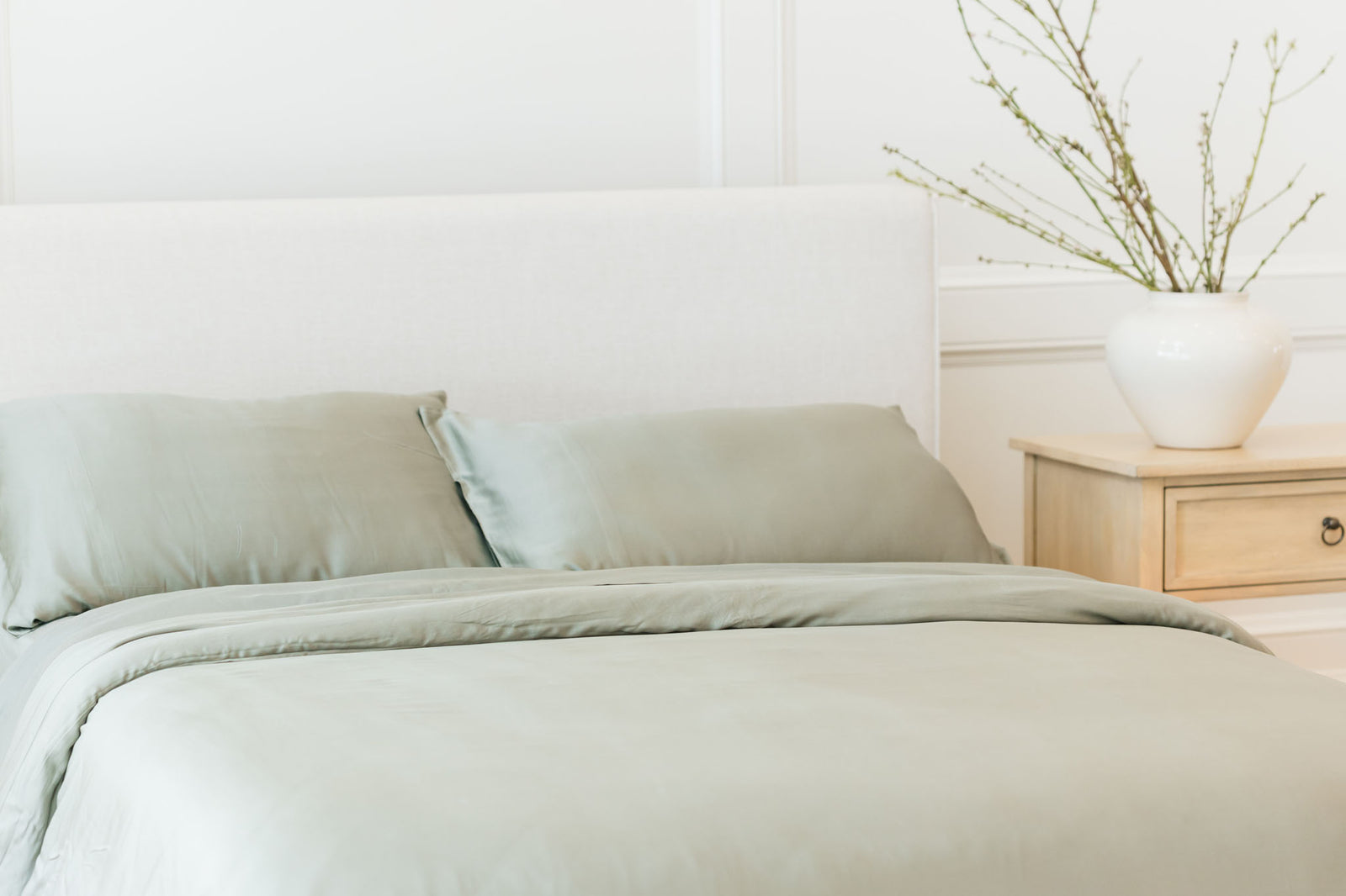 Zoomed in bed with sage bedding