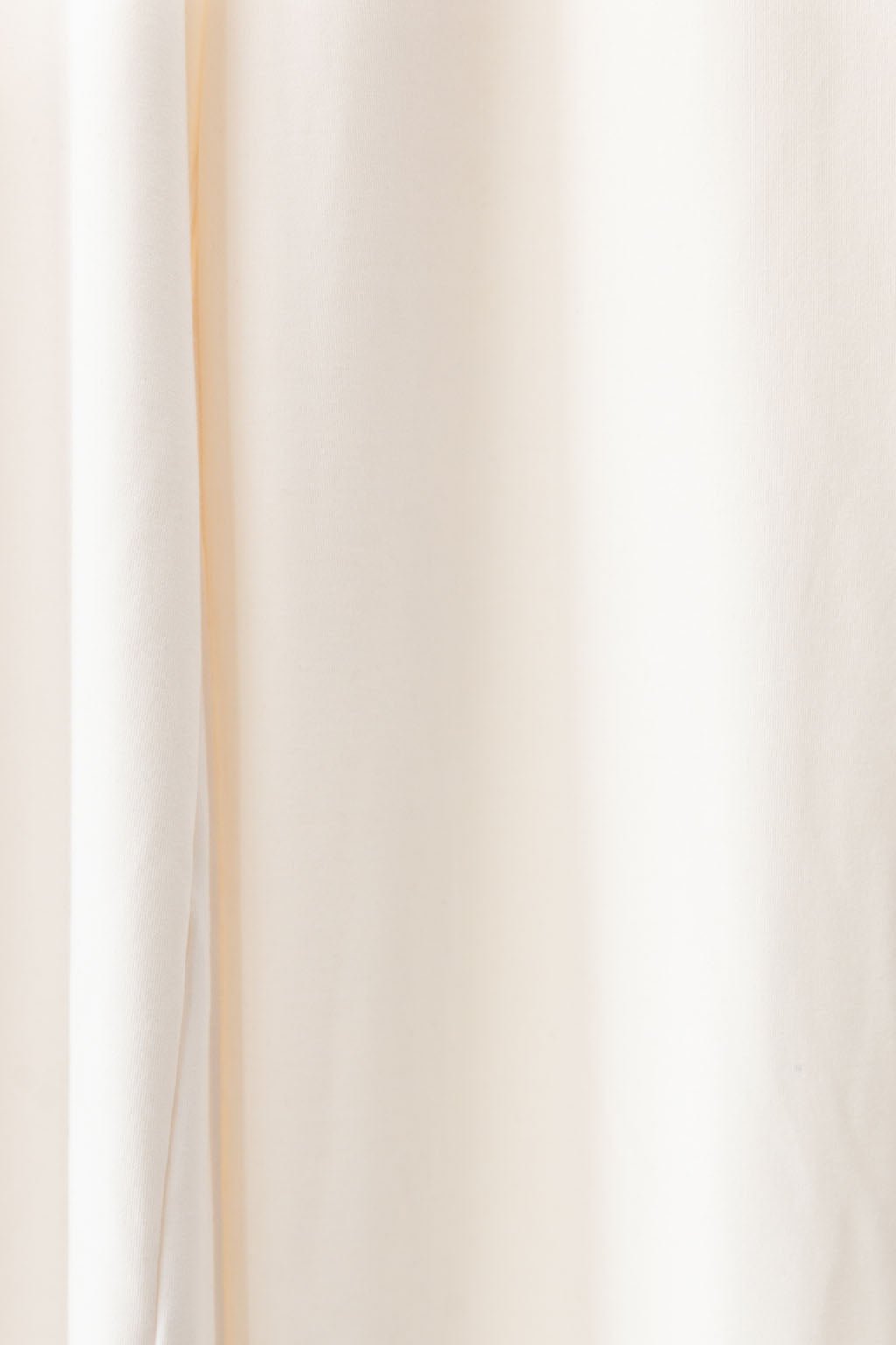 Ivory Bamboo Wide Leg Patch Pocket Pant. The photo was taken close up showing off the colors and texture of the pajamas.