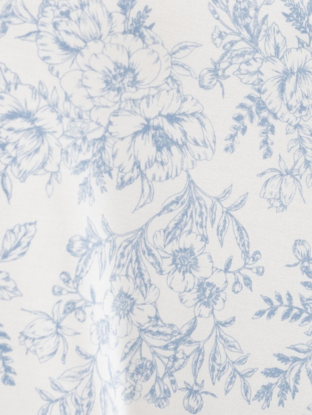 Close up of blue toile pajama fabric