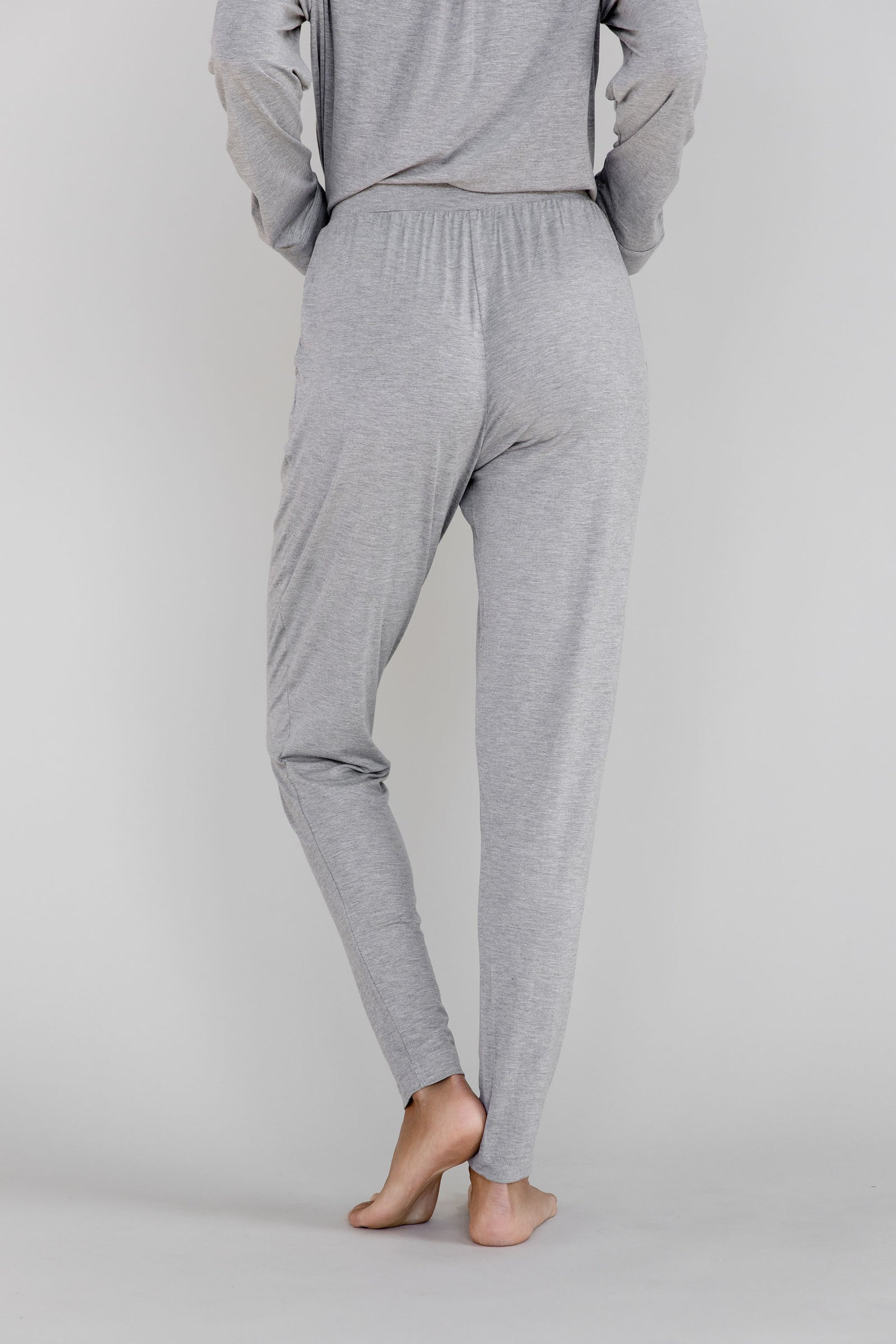 Gray Cozy Earth Stretch Knit Tapered Pant set worn by a person facing backward on a light gray background