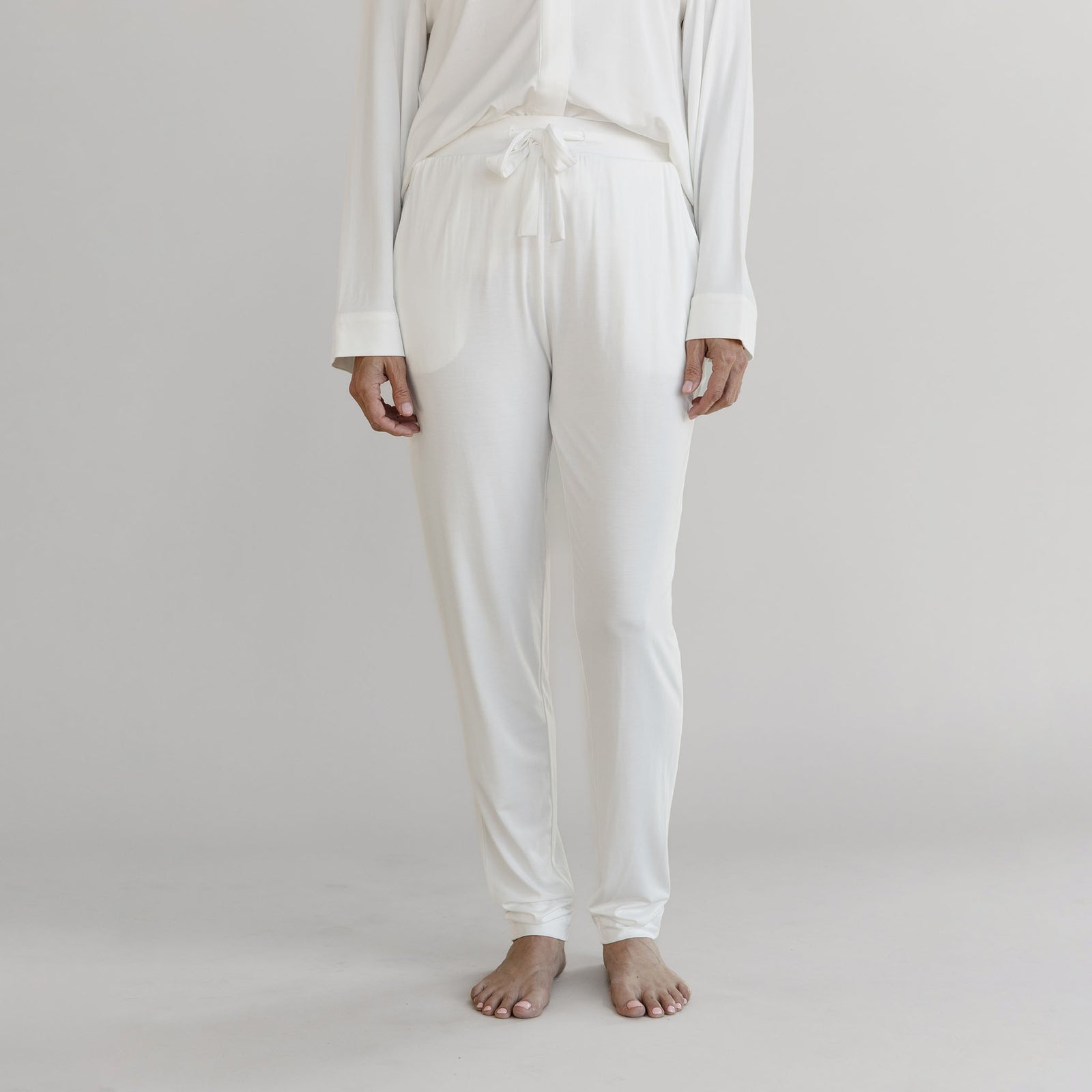 Gray Cozy Earth Stretch Knit Tapered Pant set worn by a person on a light gray background
