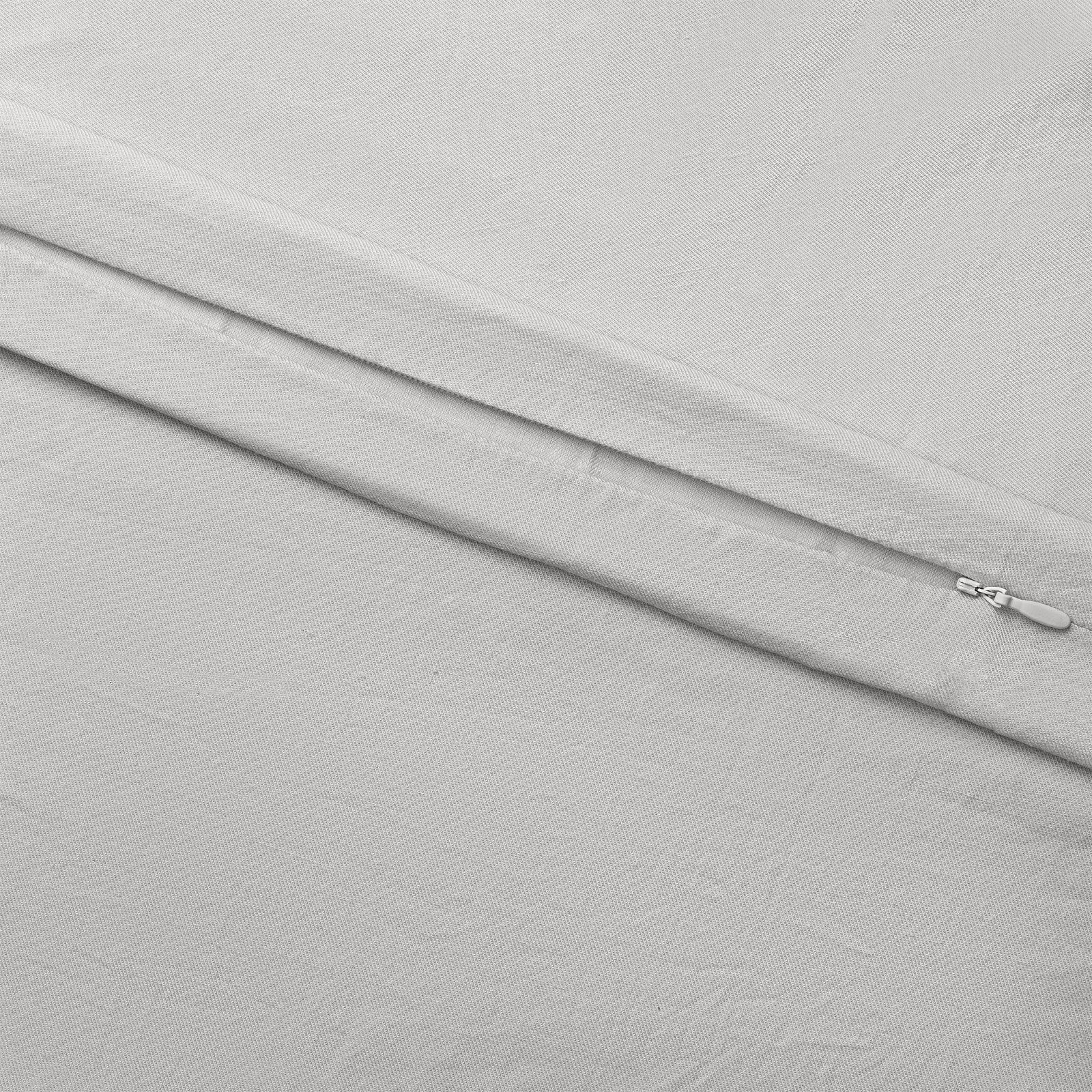 Light Grey Linen Bamboo Duvet Cover and comforter resting on a bed. Photo or product taken close up.