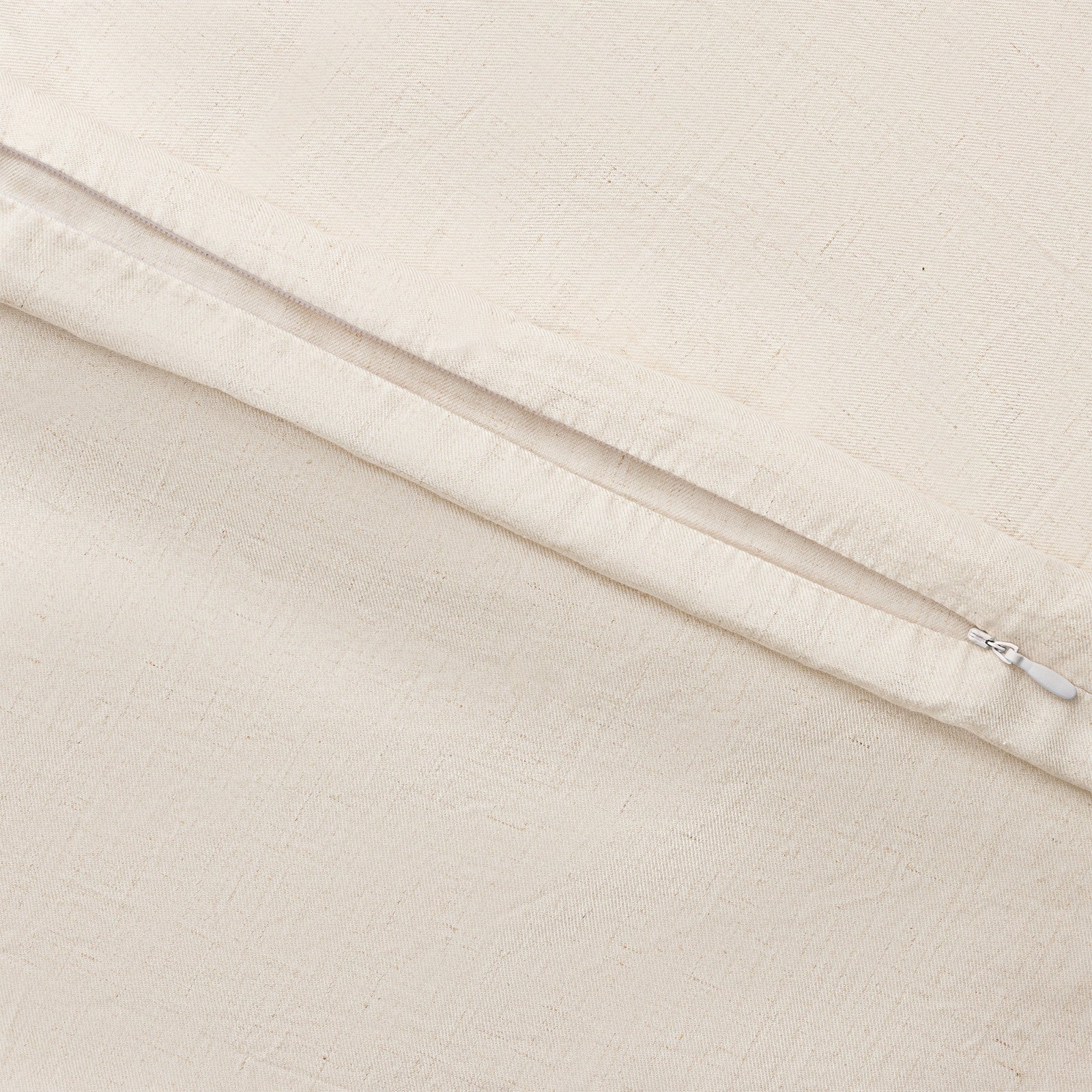 Natural Linen Bamboo Duvet Cover and comforter resting on a bed. Photo or product taken close up.