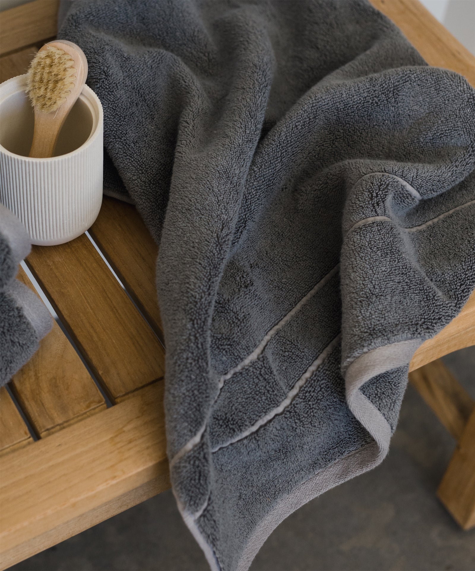 Premium Plush Bath Towel in the color Charcoal. Photo of Charcoal Premium Plush Bath towel taken as a close up of the Premium Plush Bath Towel.