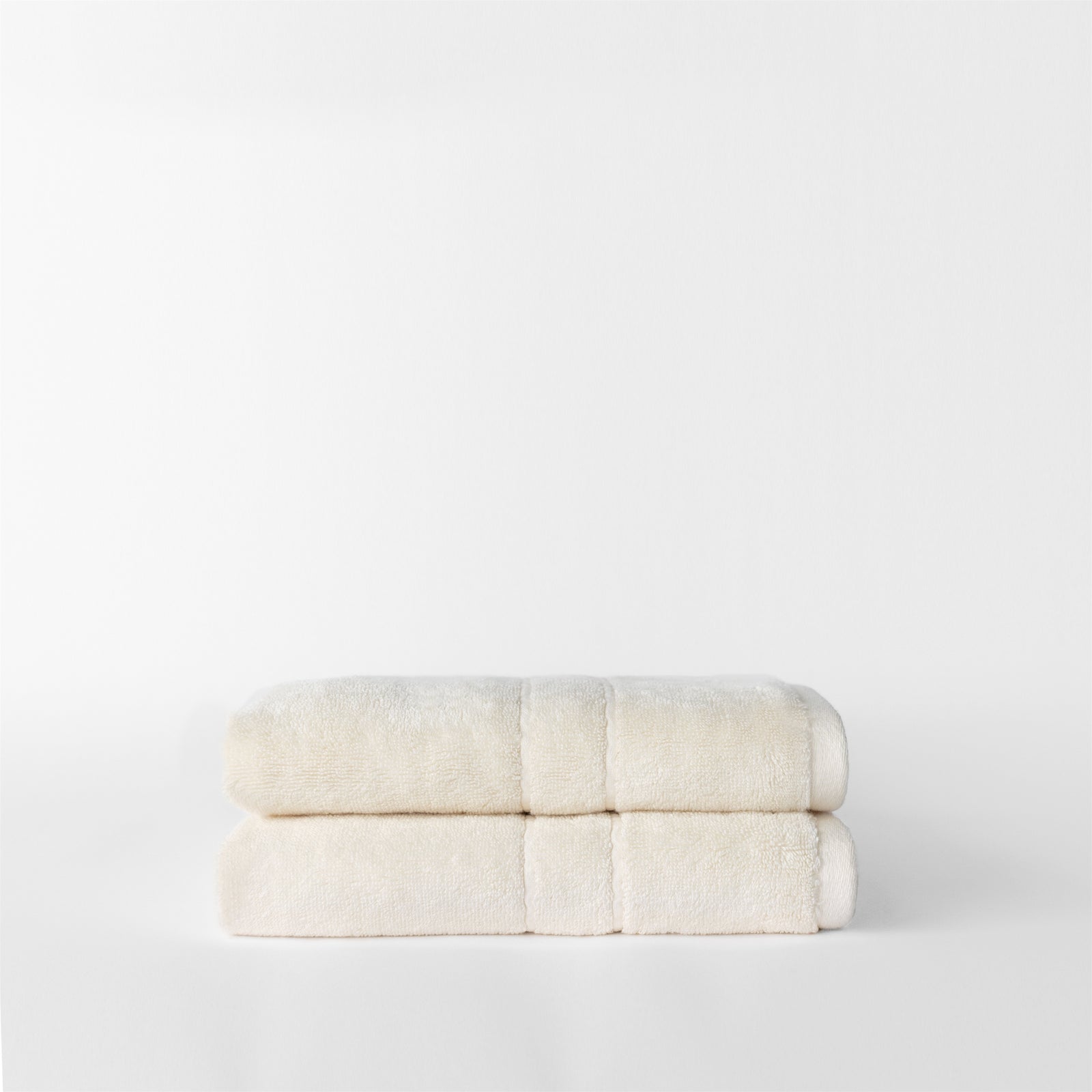 Premium Plush Hand Towels in the color creme. Photo of Complete Premium Plush Hand Towel taken with white background