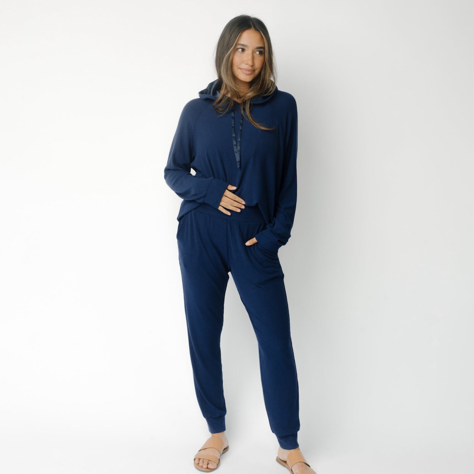 Person wearing navy Cozy Earth Rib Knit Joggers on a white background