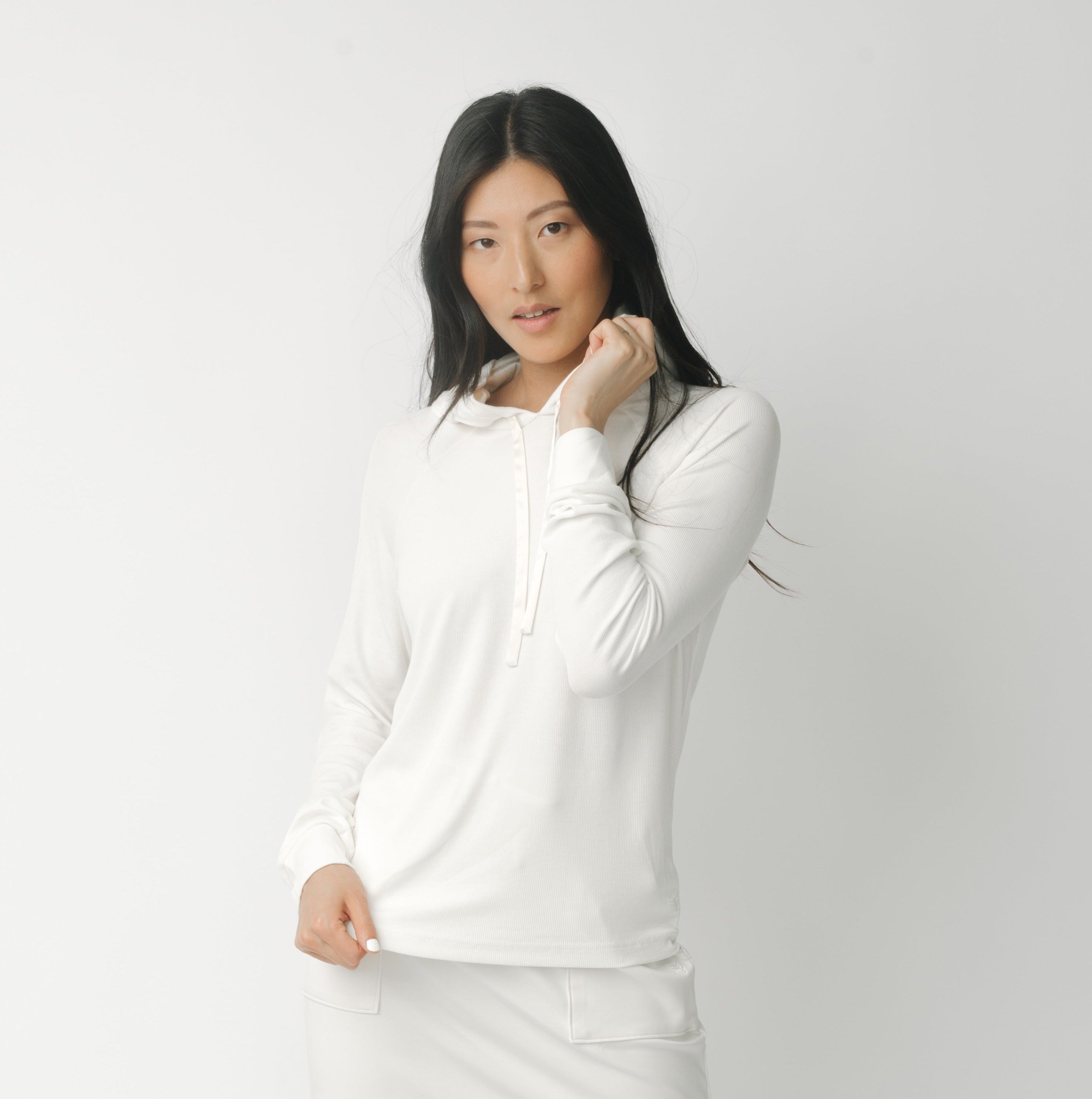 A woman wearing a white Cozy Earth Brushed Bamboo Hoodie against a plain background |Color:Ivory