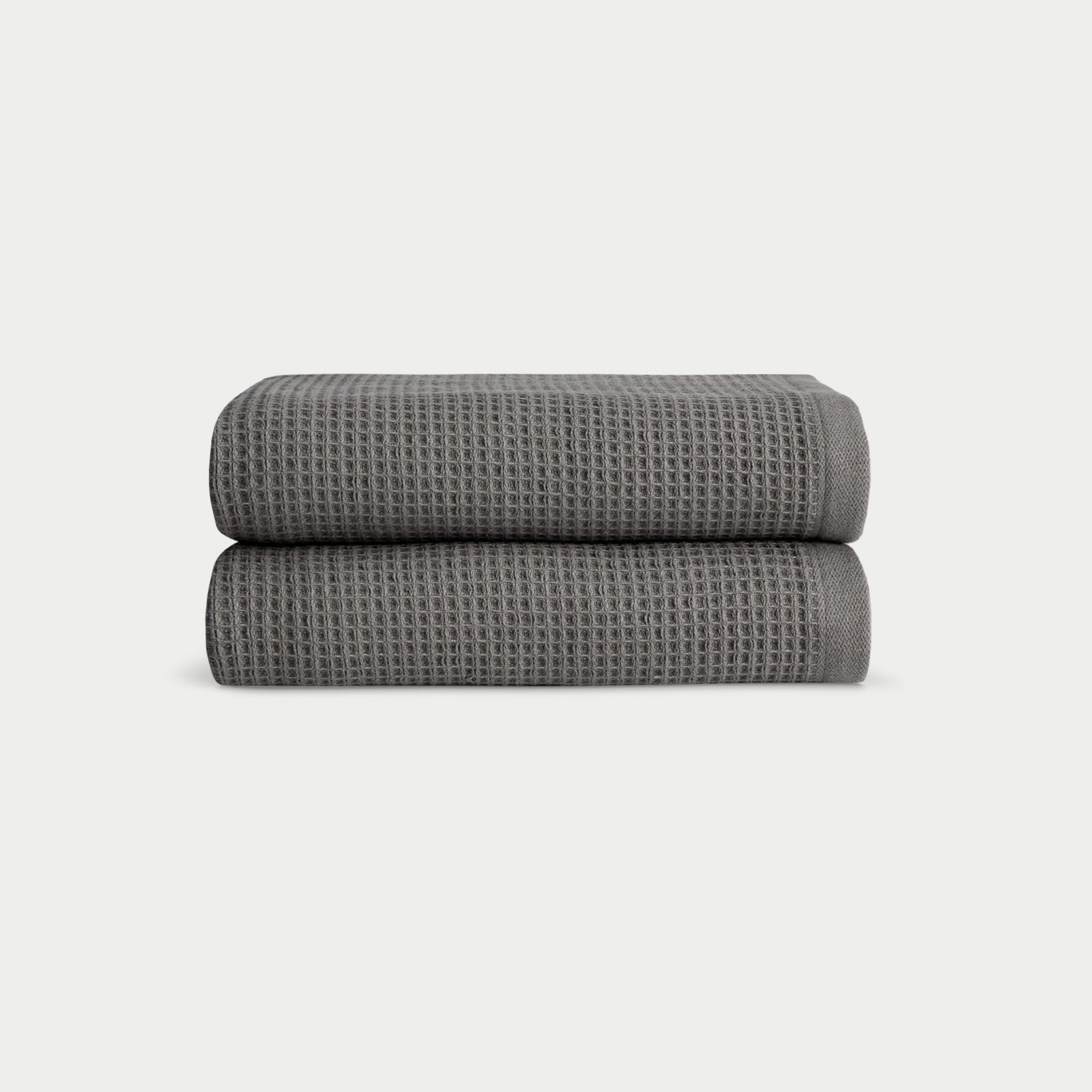Charcoal Waffle Hand Towel set neatly folded. The photo was taken with a white background.