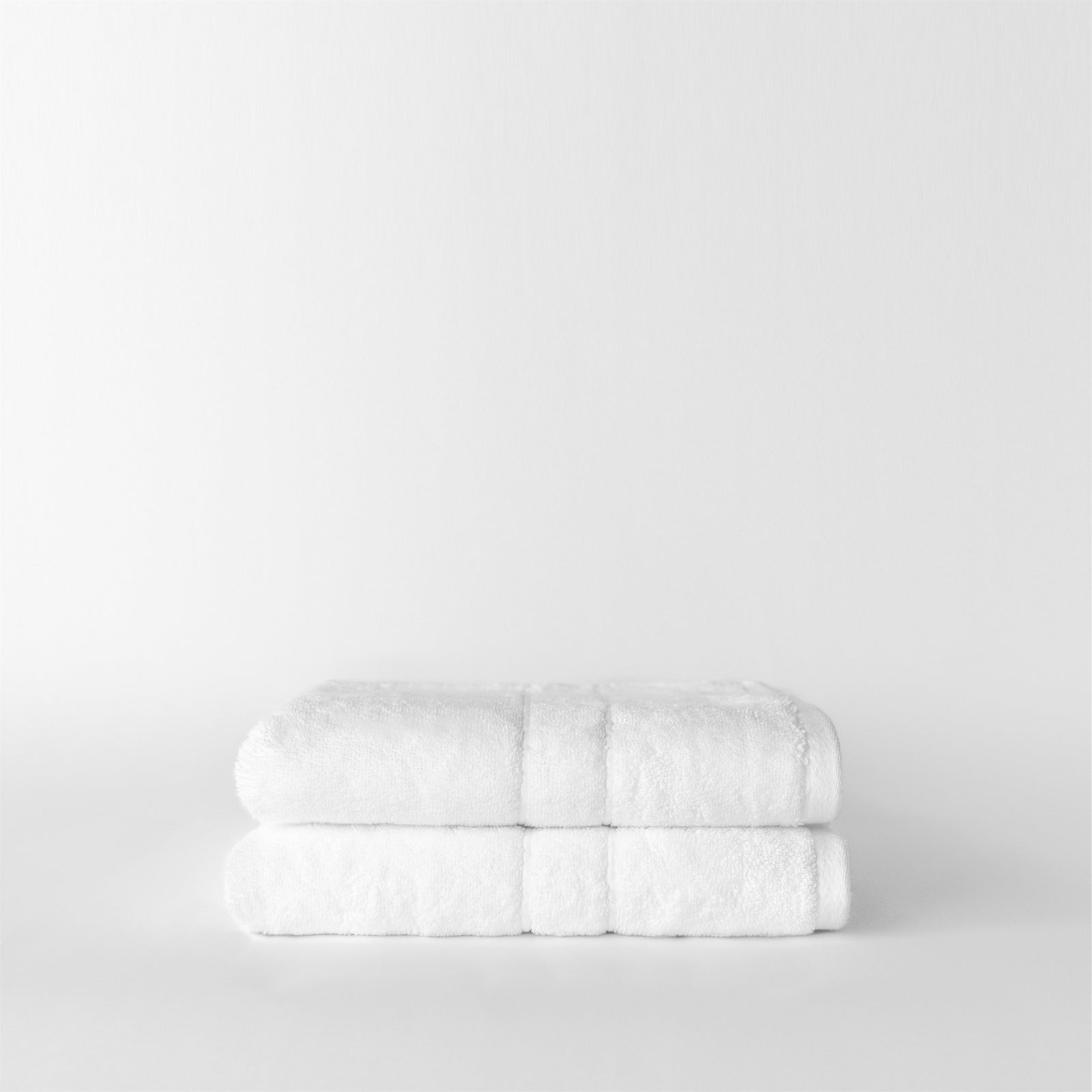 Premium Plush Hand Towels in the color white. Photo of Complete Premium Plush Hand Towel taken with white background 