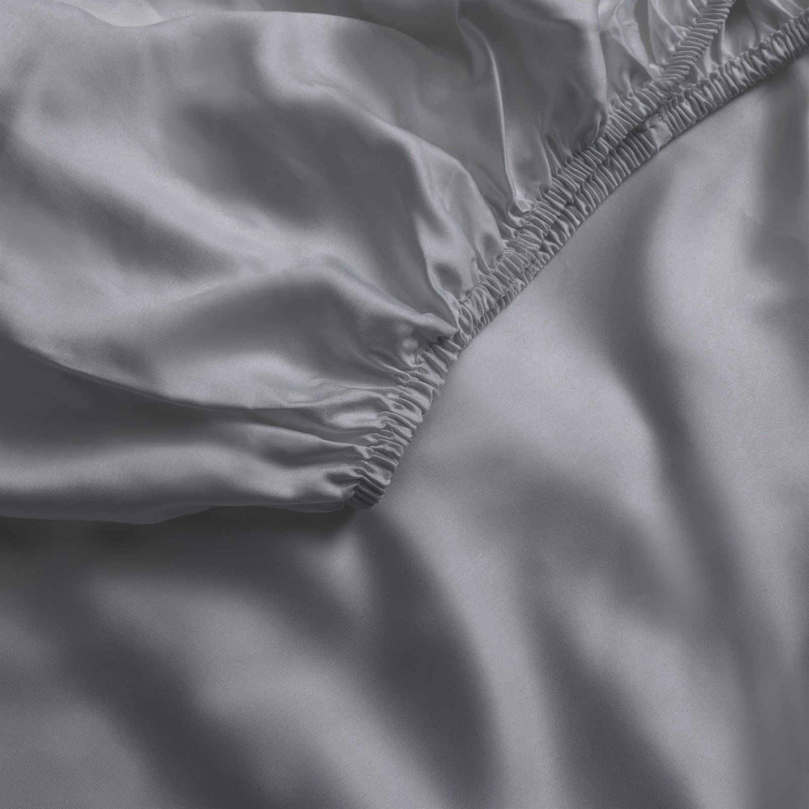 Close up of charcoal fitted crib sheet 