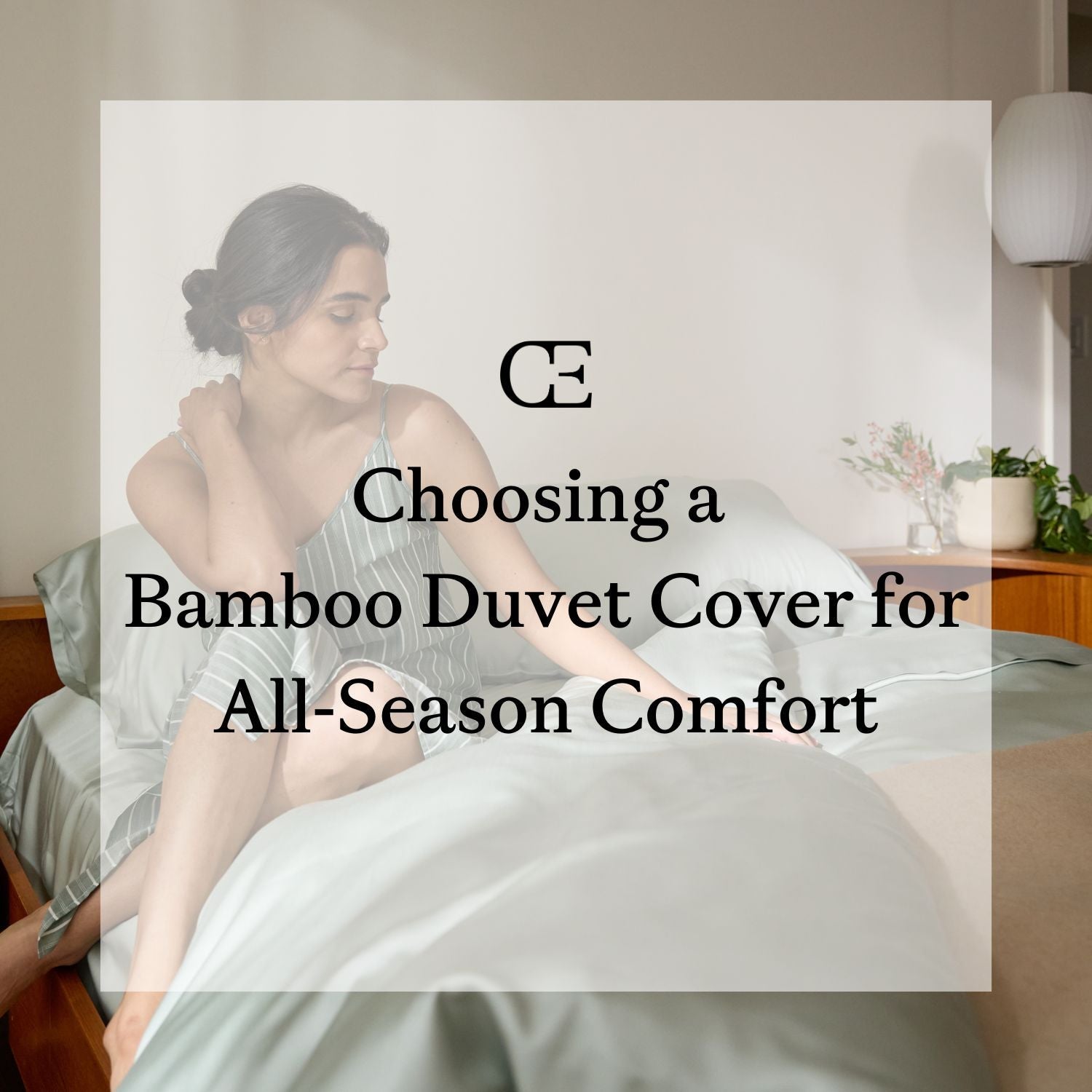 A woman sits on a bed with green Cozy Earth bedding