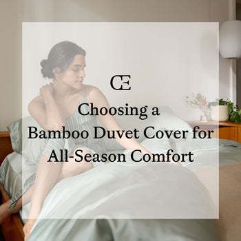 A woman sits on a bed with green Cozy Earth bedding