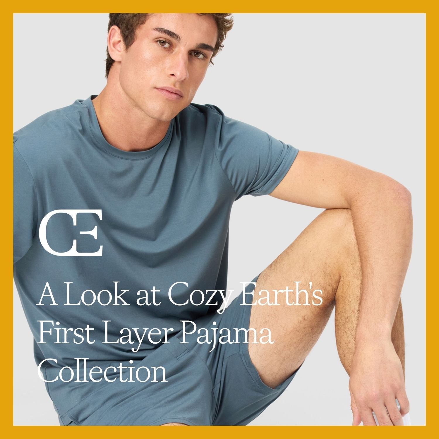 A man sits wearing blue First Layer Pajama Tee and Shorts Set