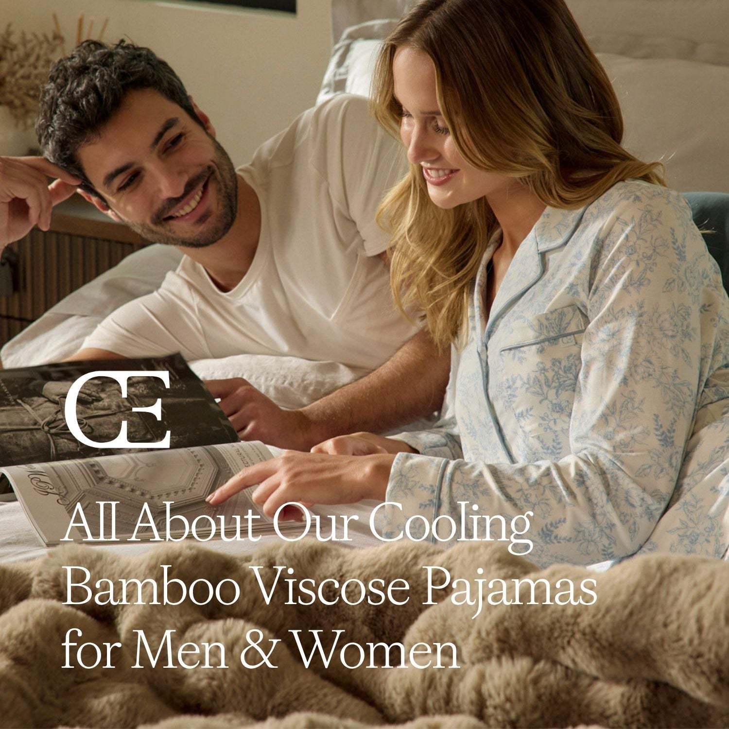 a man and woman sit on a bed in pajamas