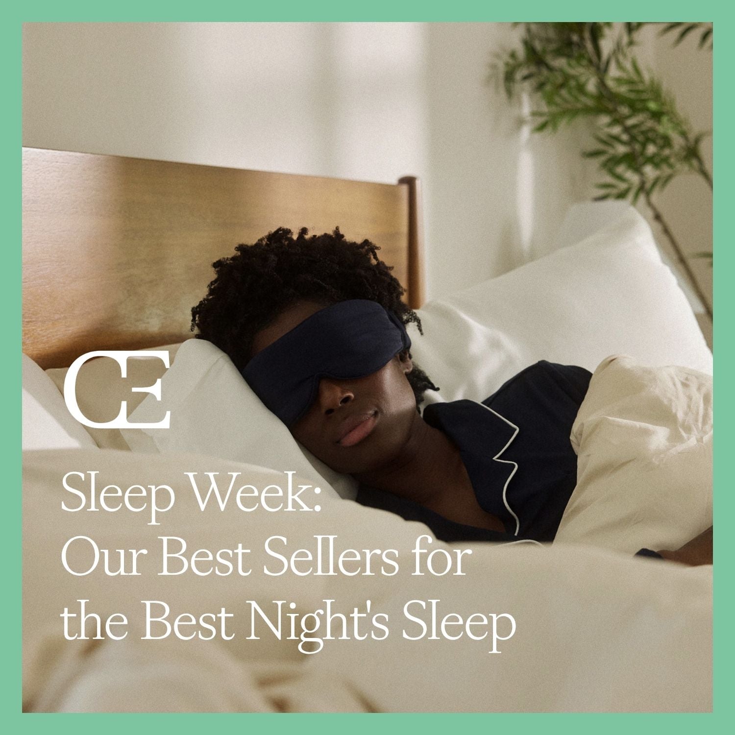 A woman wearing a sleep mask sleeps in a bed with cream bedding