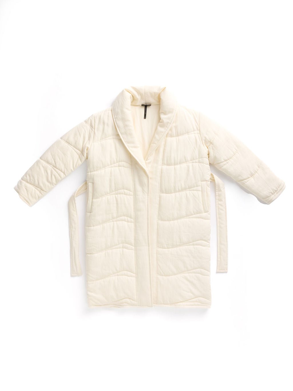 The Women's Quilted House Coat by Cozy Earth is cream-colored with long sleeves, a shawl collar, padded design, and a waist tie, shown on a white background. 