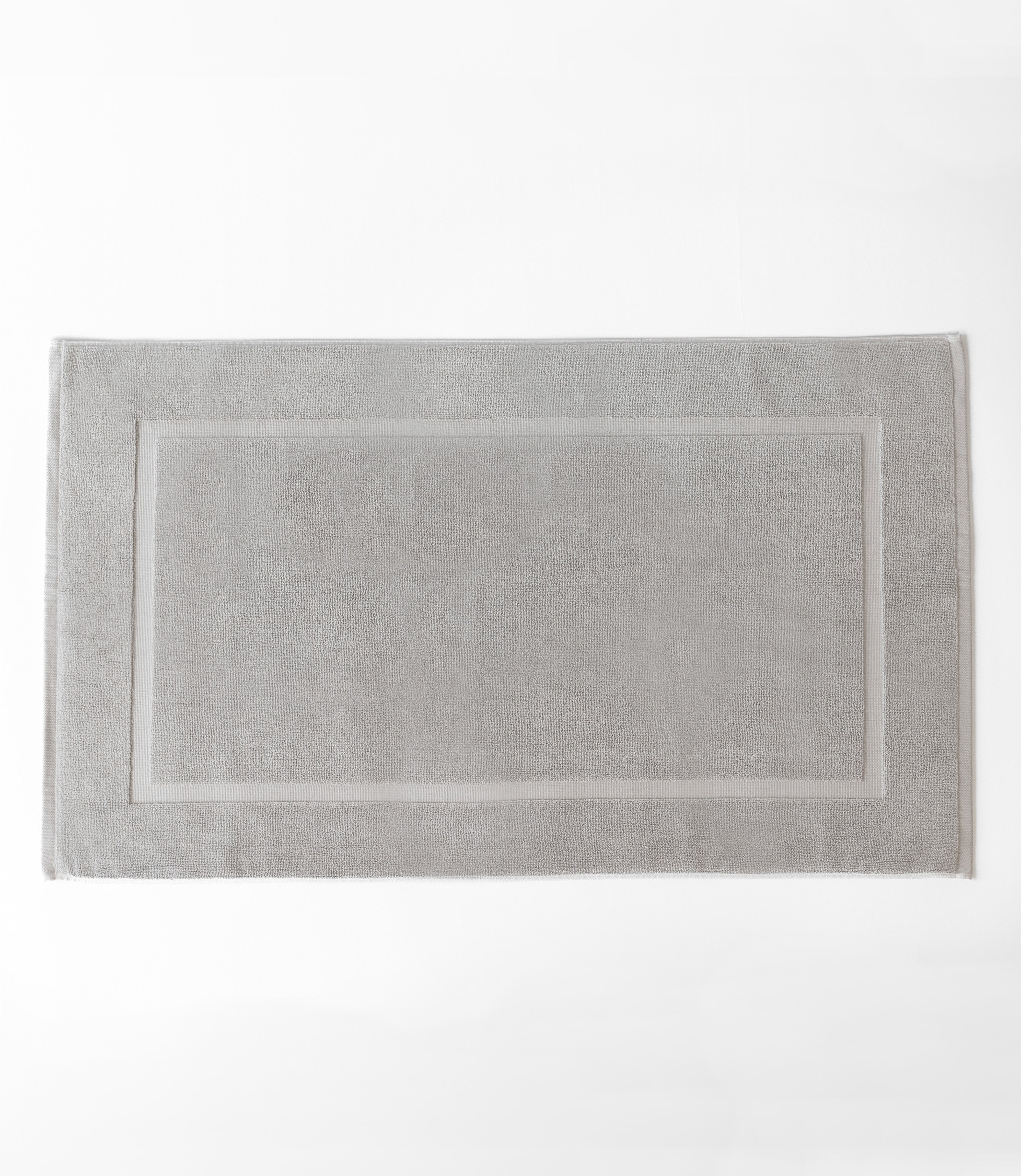 Light Grey Premium Plush Bath Mat resting on white background.|Color:Light Grey