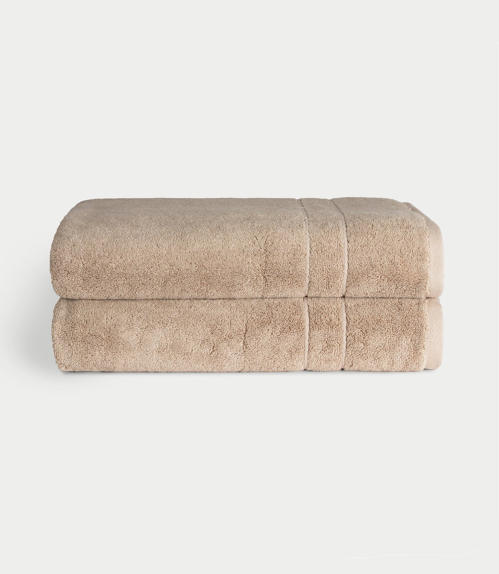 Premium Plush Bath Sheets in the color sand. Photo of bath sheets taken with white background 