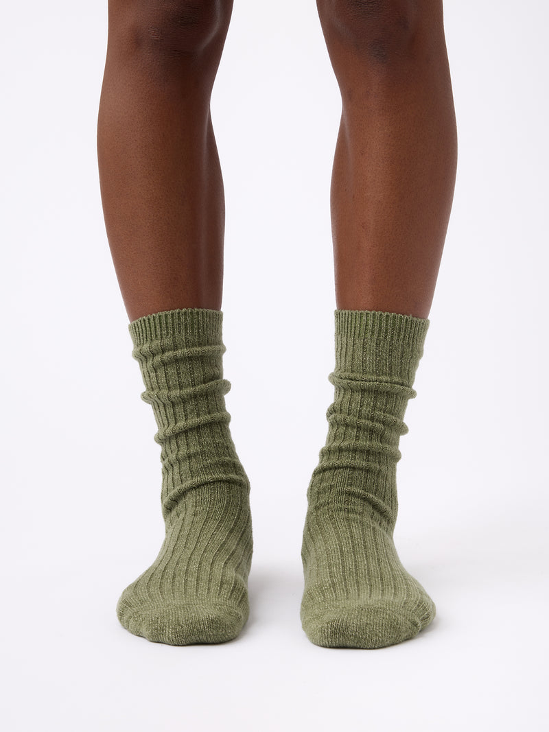 Person wearing Cozy Earth Plush Lounge Calf Sock in Juniper