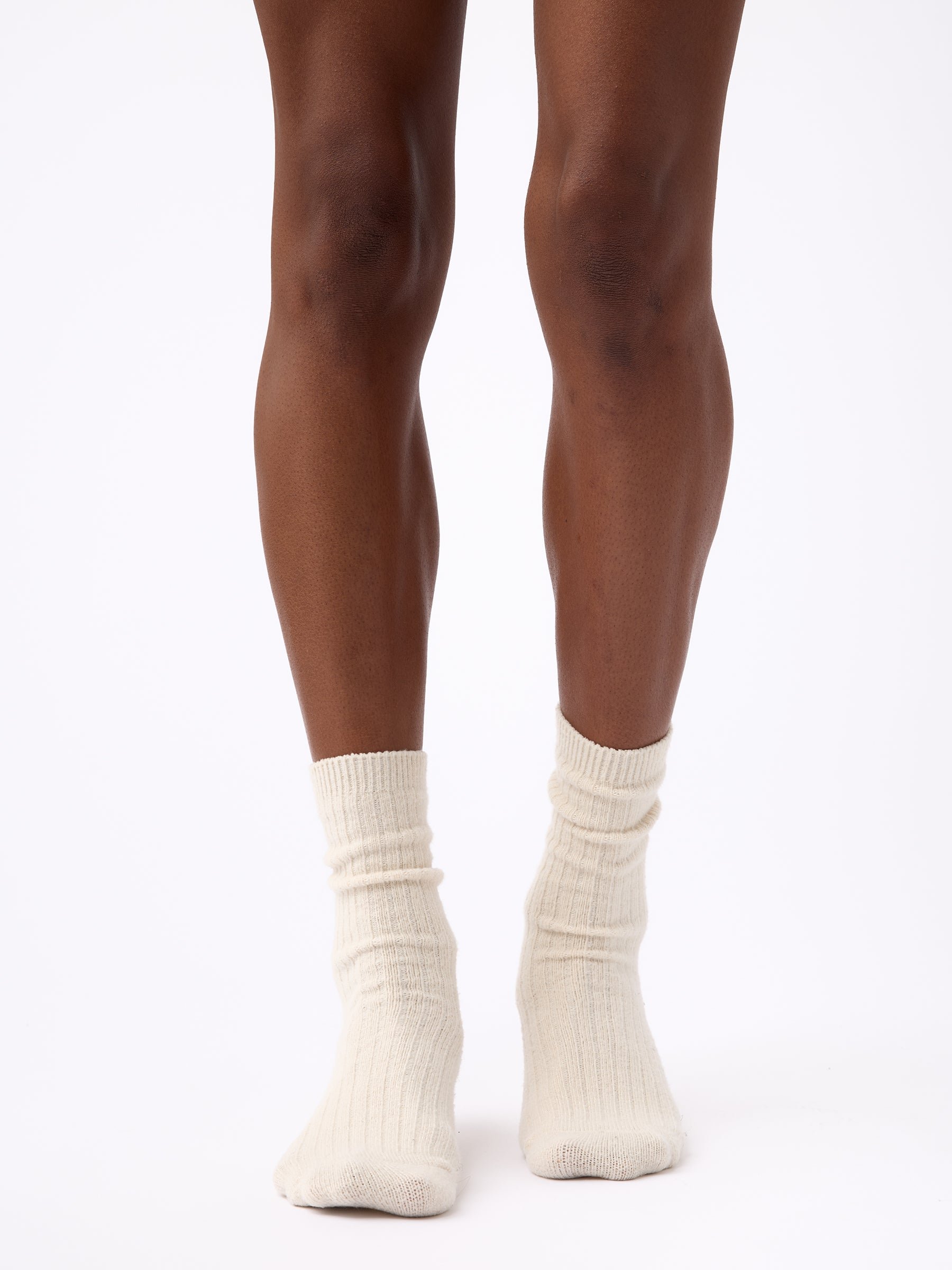 Person wearing Cozy Earth Plush Lounge Sock in Alabaster 
