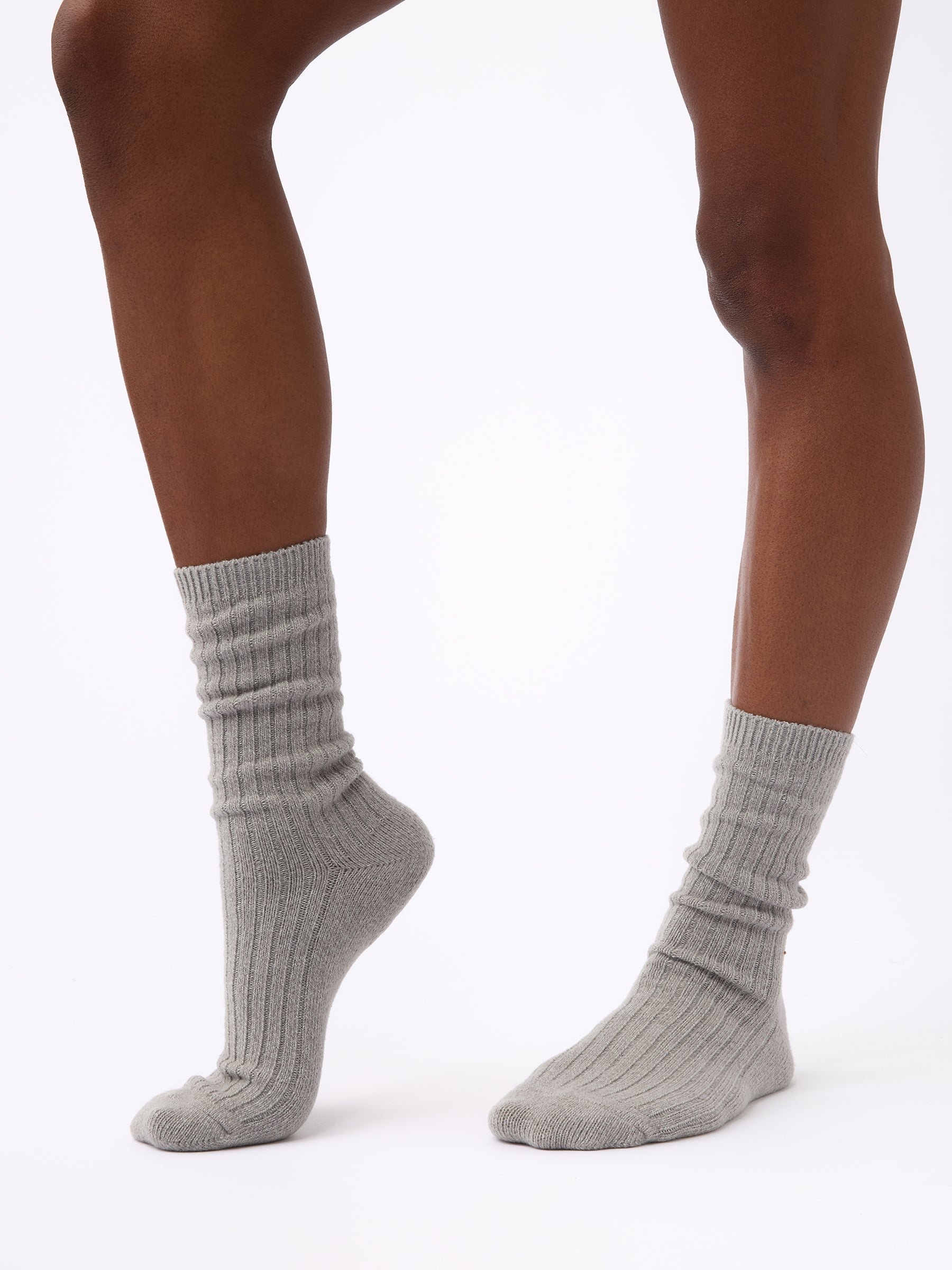 Person wearing Cozy Earth Plush Lounge Sock in Stone 