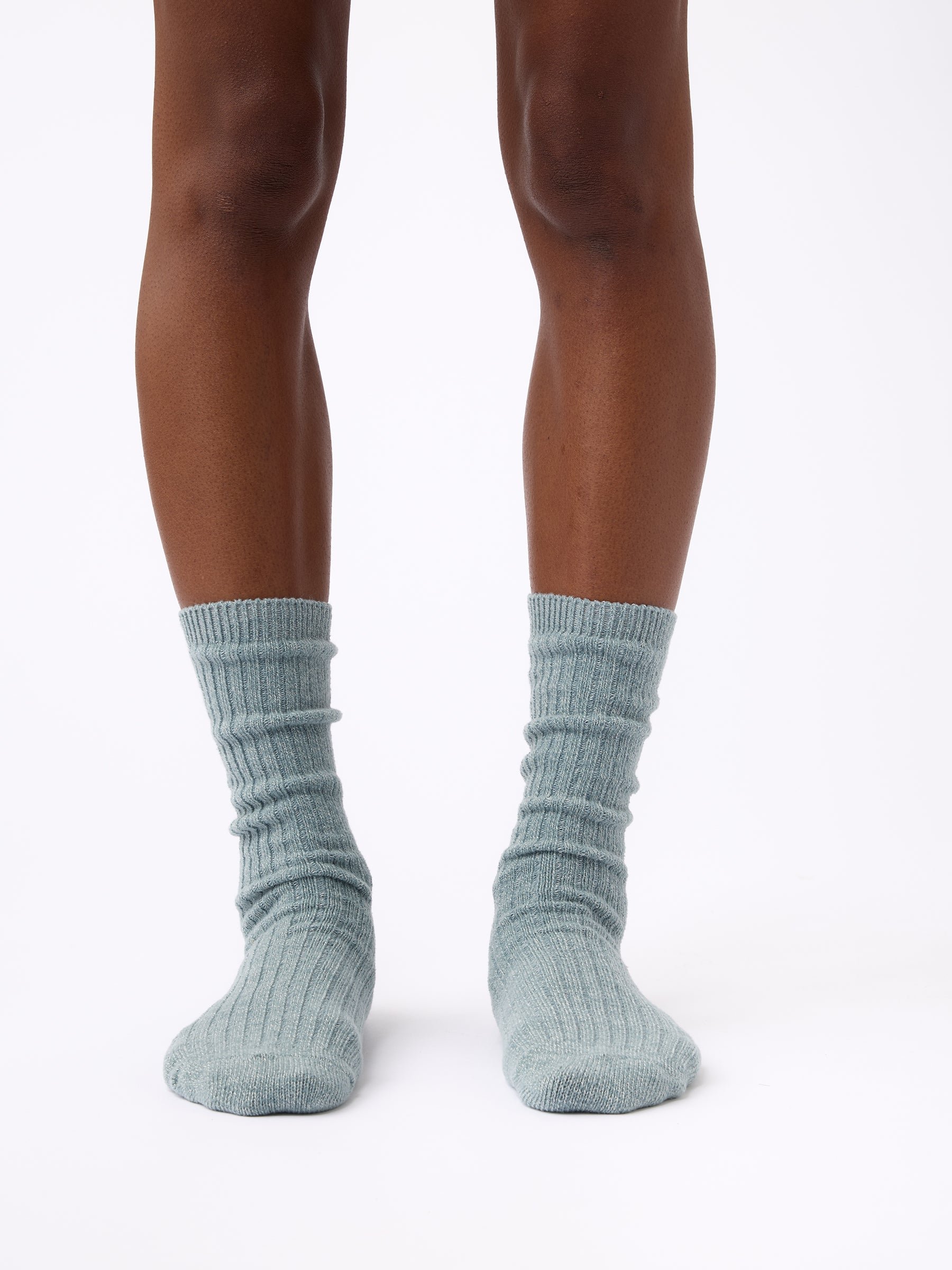Person wearing Cozy Earth Plush Lounge Sock in Smokey Blue 
