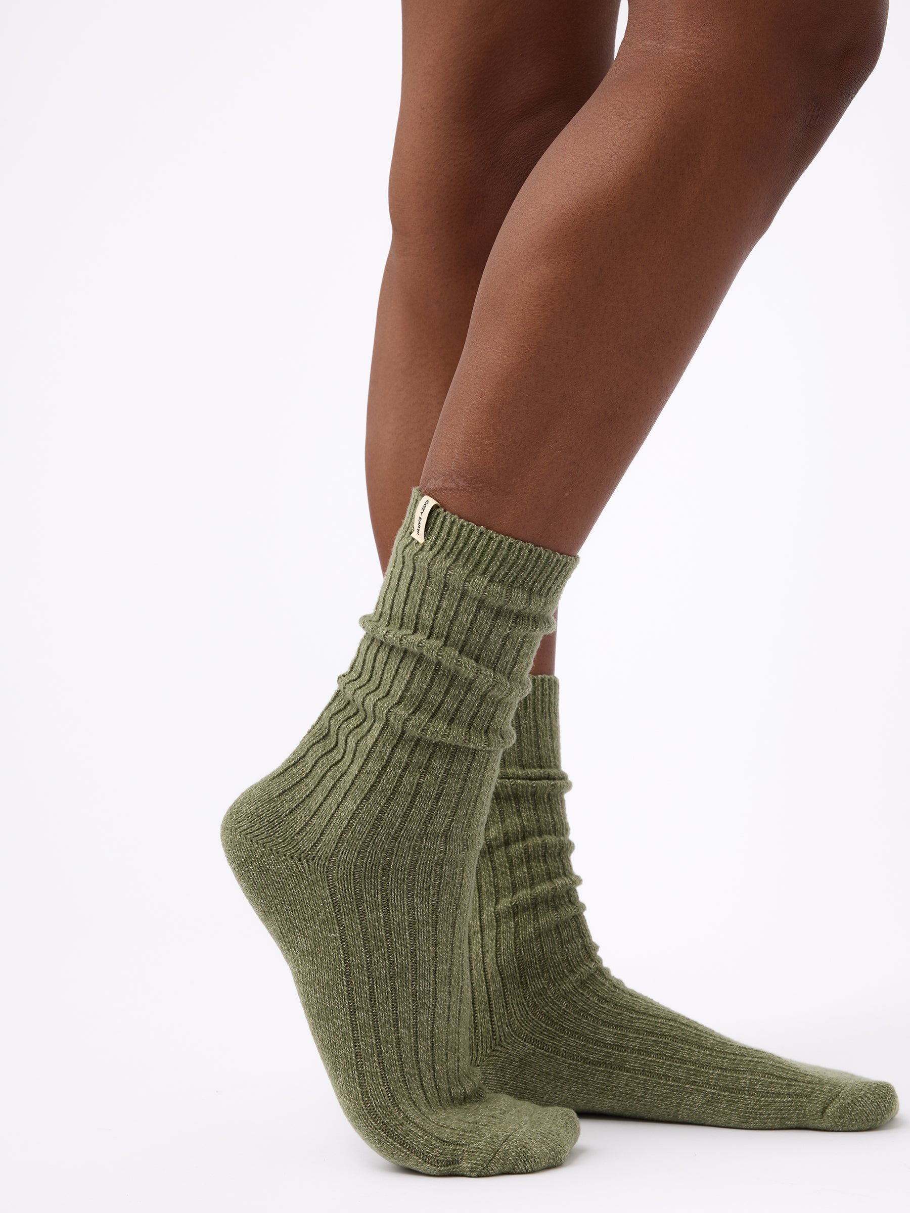 Person wearing Cozy Earth Plush Lounge Sock in Juniper 