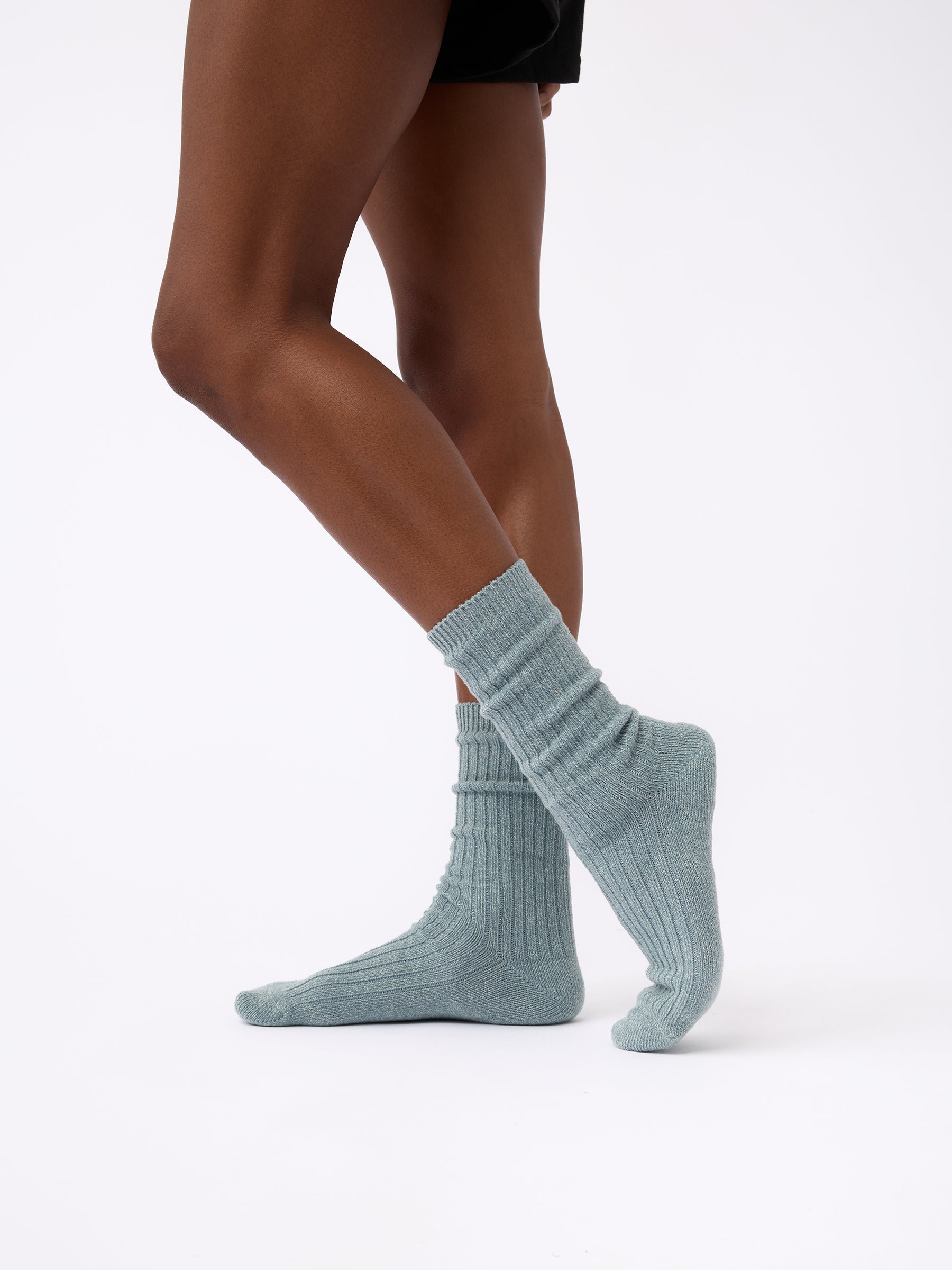 Person wearing Cozy Earth Plush Lounge Sock in Smokey Blue 