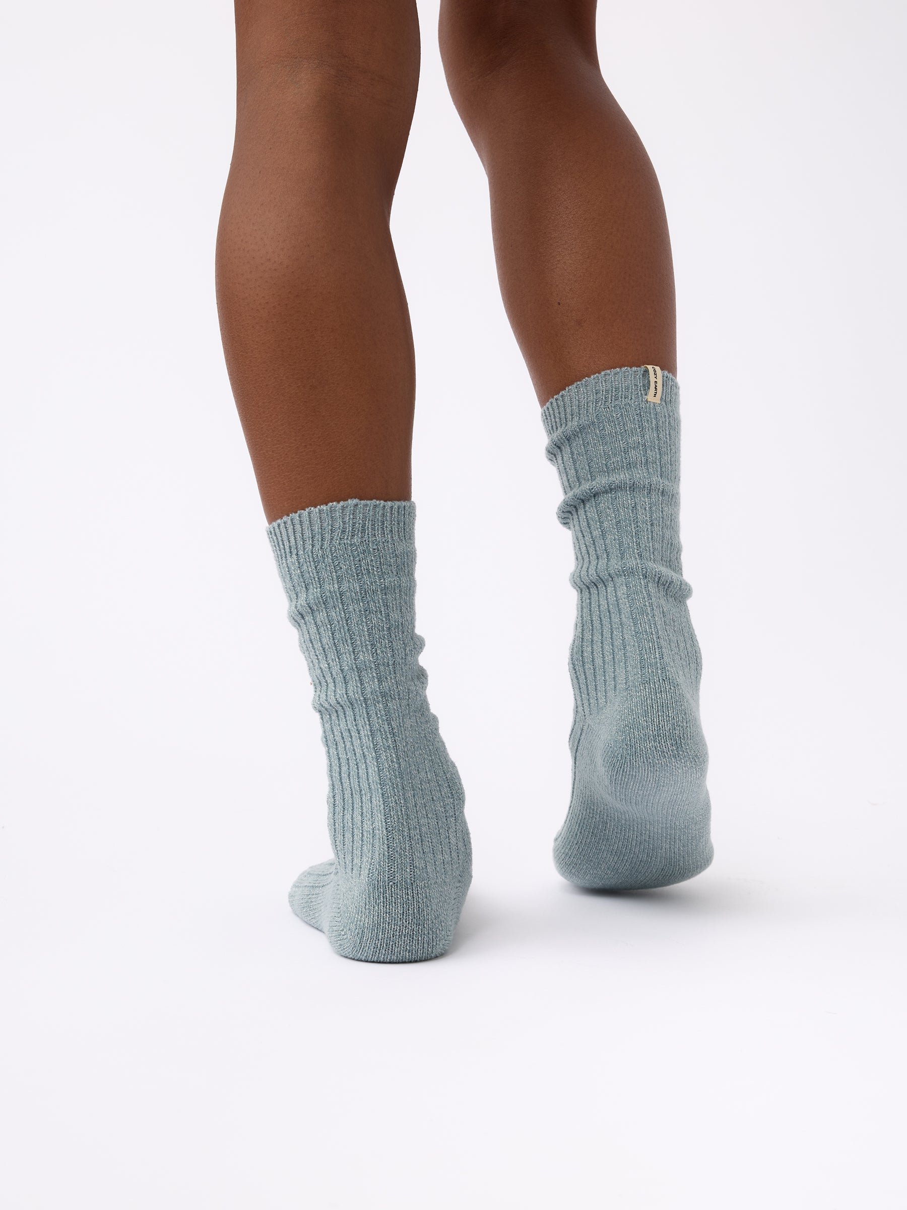 Person wearing Cozy Earth Plush Lounge Sock in Smokey Blue 