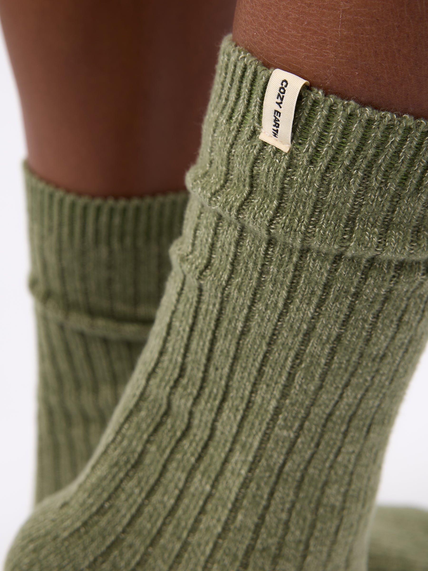 Close-up of tag on Cozy Earth Plush Lounge Sock in Juniper 