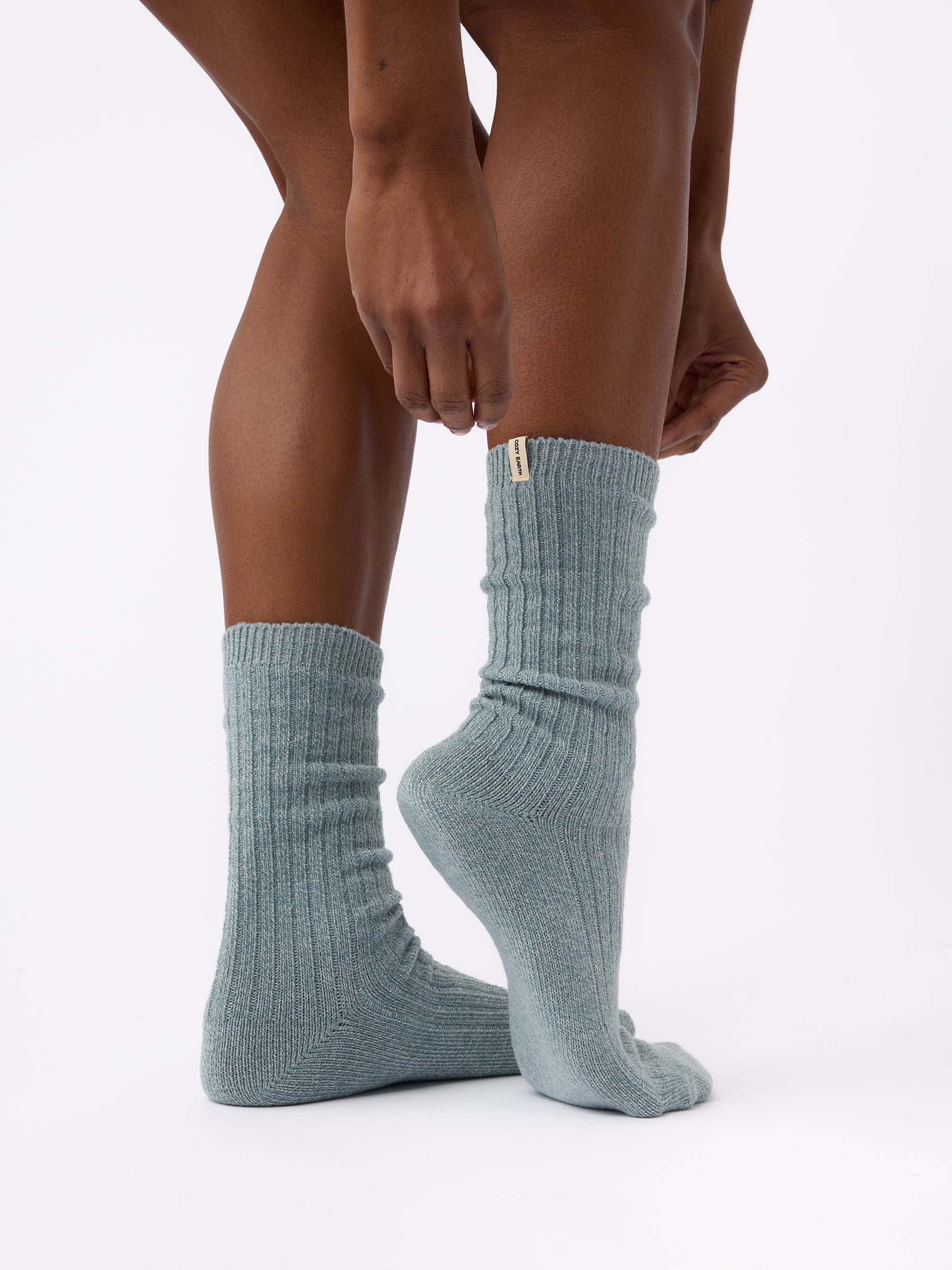 Person wearing Cozy Earth Plush Lounge Sock in Smokey Blue 